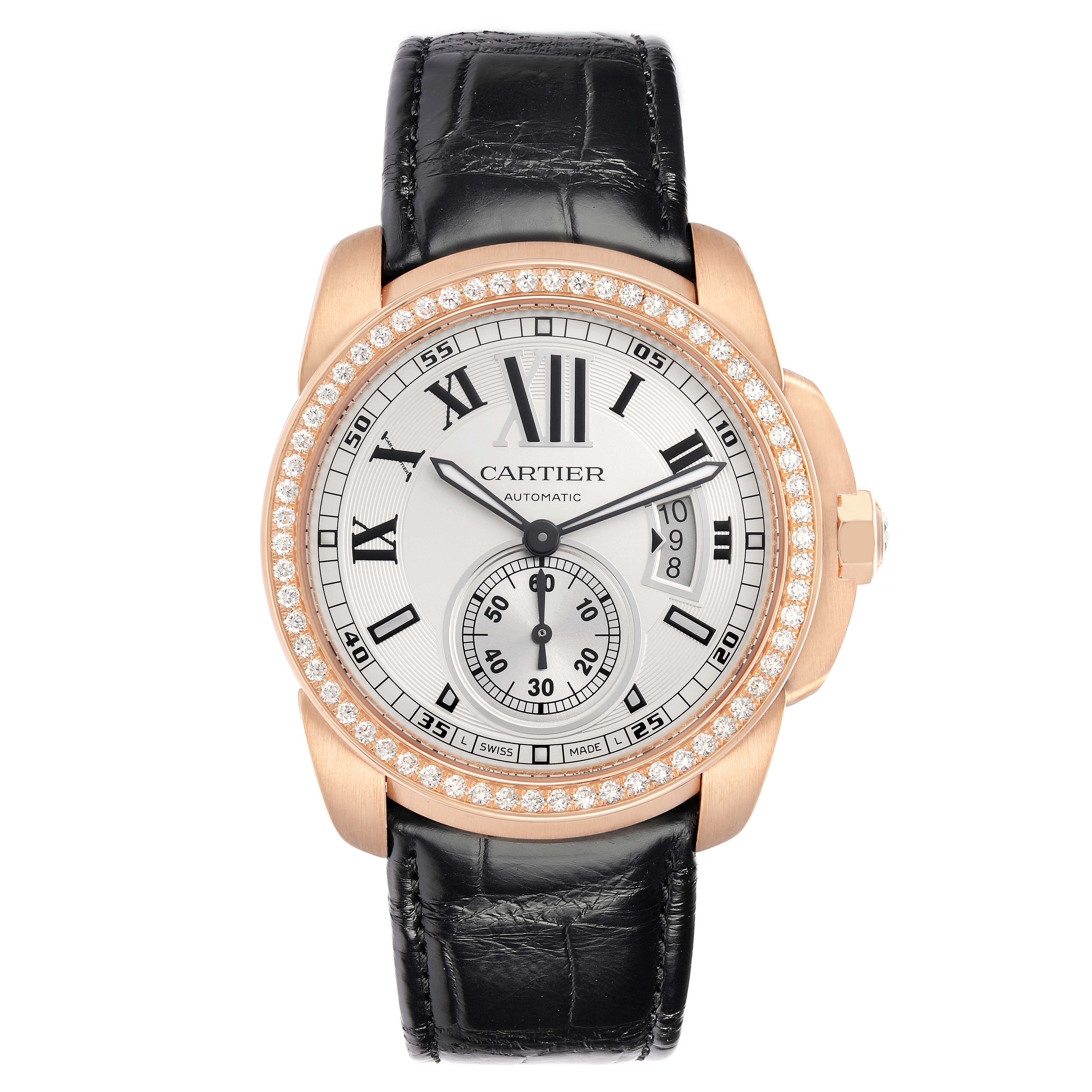 The Calibre de Cartier watch by Cartier is shown from a front angle, displaying the face, strap, and bezel details.