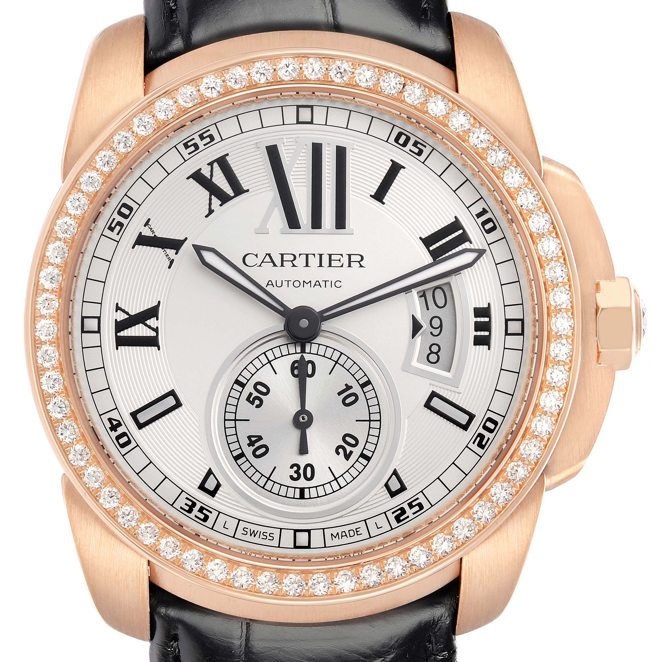 The Calibre de Cartier watch is shown from the front, highlighting its diamond bezel, Roman numerals, date window, and leather strap.