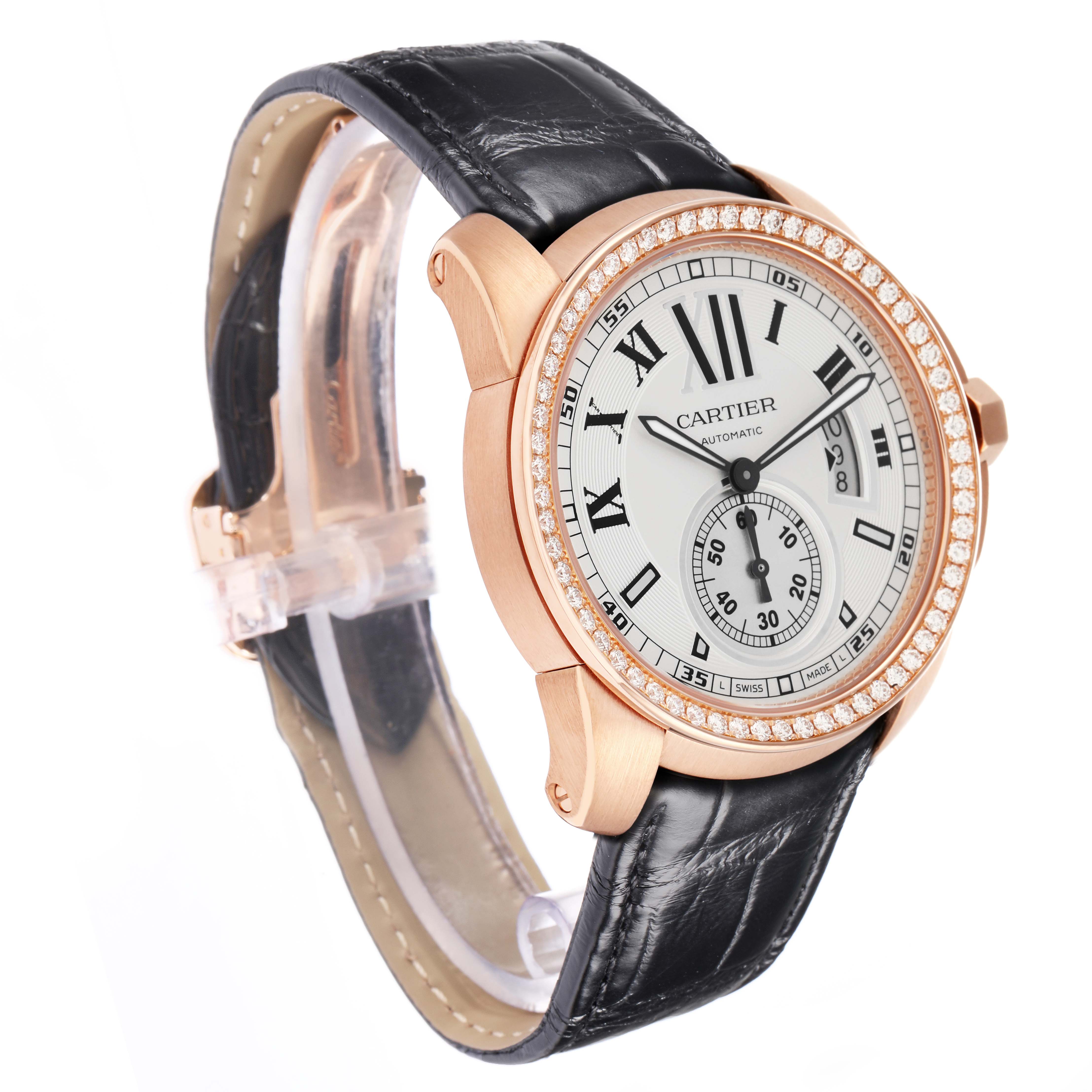 The Calibre de Cartier watch is shown at a slight angle, displaying the face, bezel, and part of the leather strap.