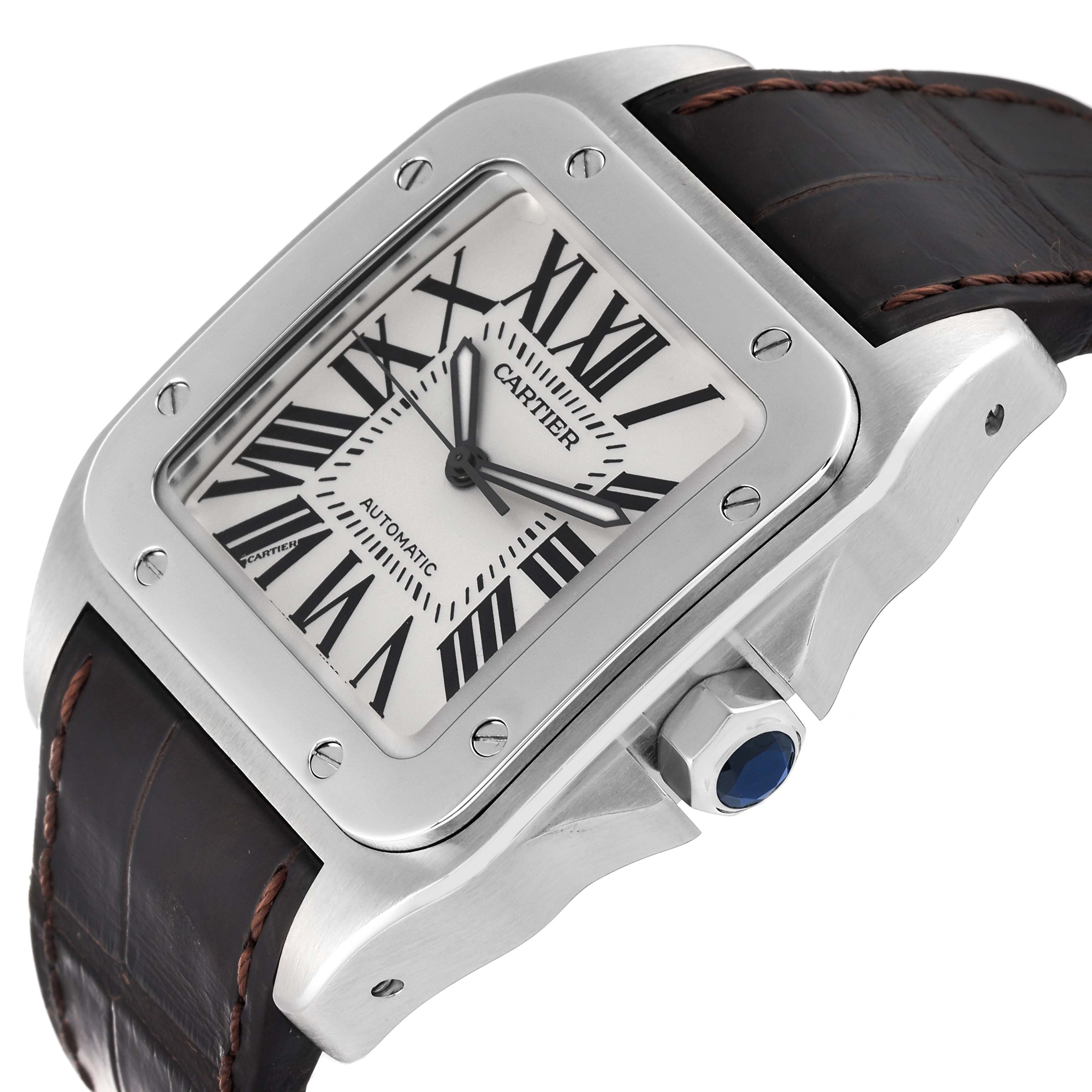 This Cartier Santos W20073X8 Men
s Stainless Steel Silver Dial W20073X8 Men
s Stainless Steel Silver Dial watch is shown at an angle displaying its face, Roman numeral dial, bezel, crown, and leather strap.