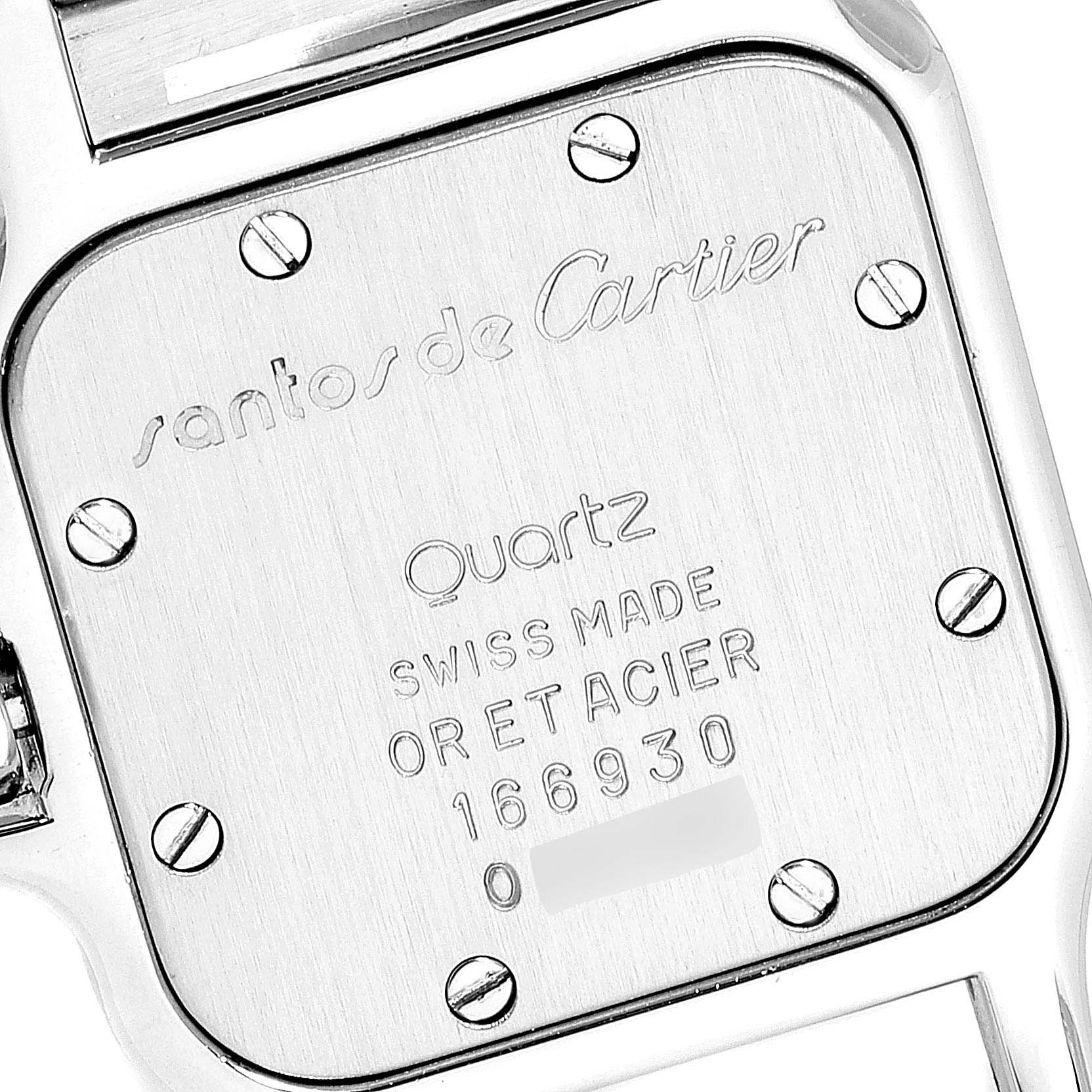 The image shows the back case of a Santos de Cartier watch, highlighting inscriptions and screw details.