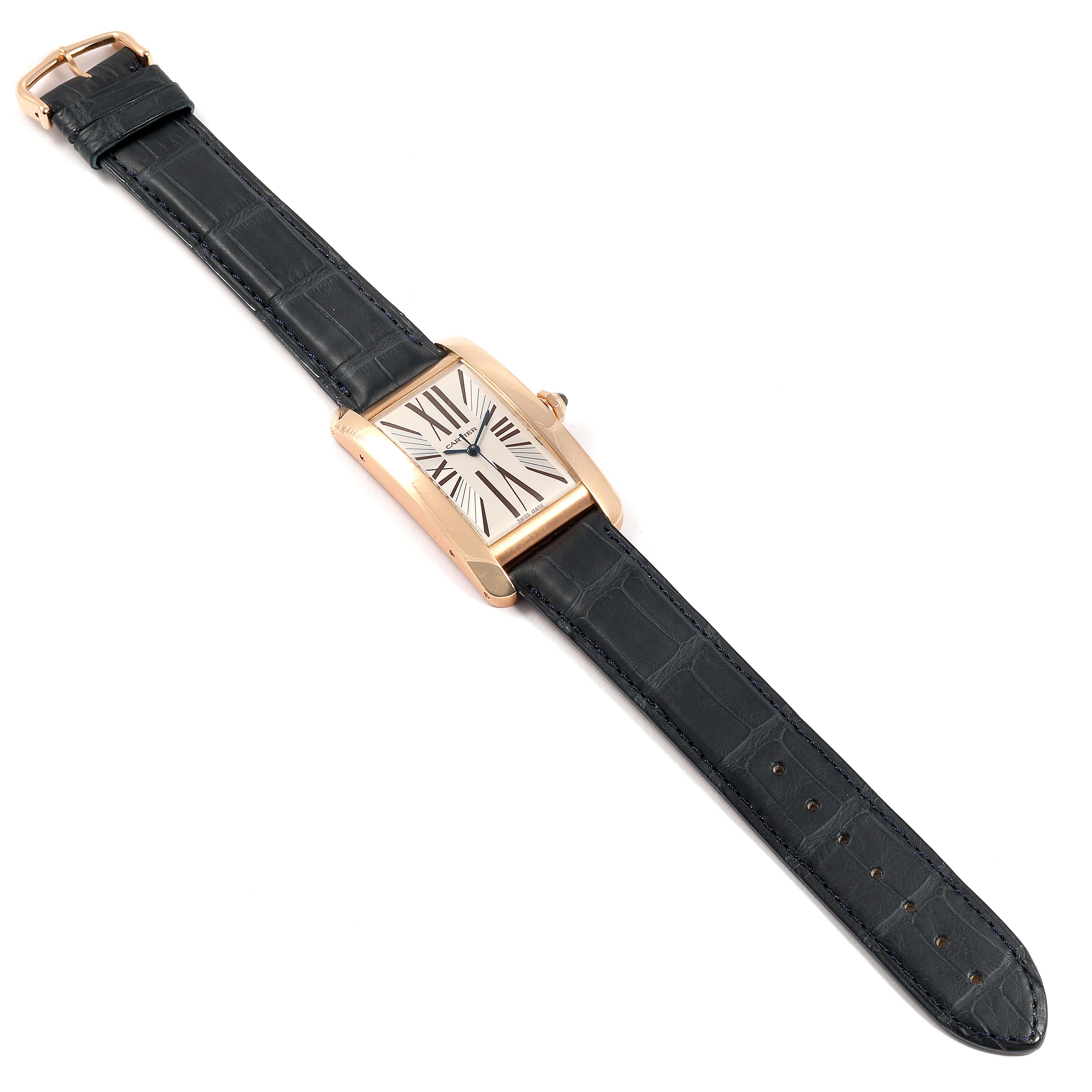 The image shows an overhead view of a Cartier Tank Américaine watch with a black leather strap and rectangular face.