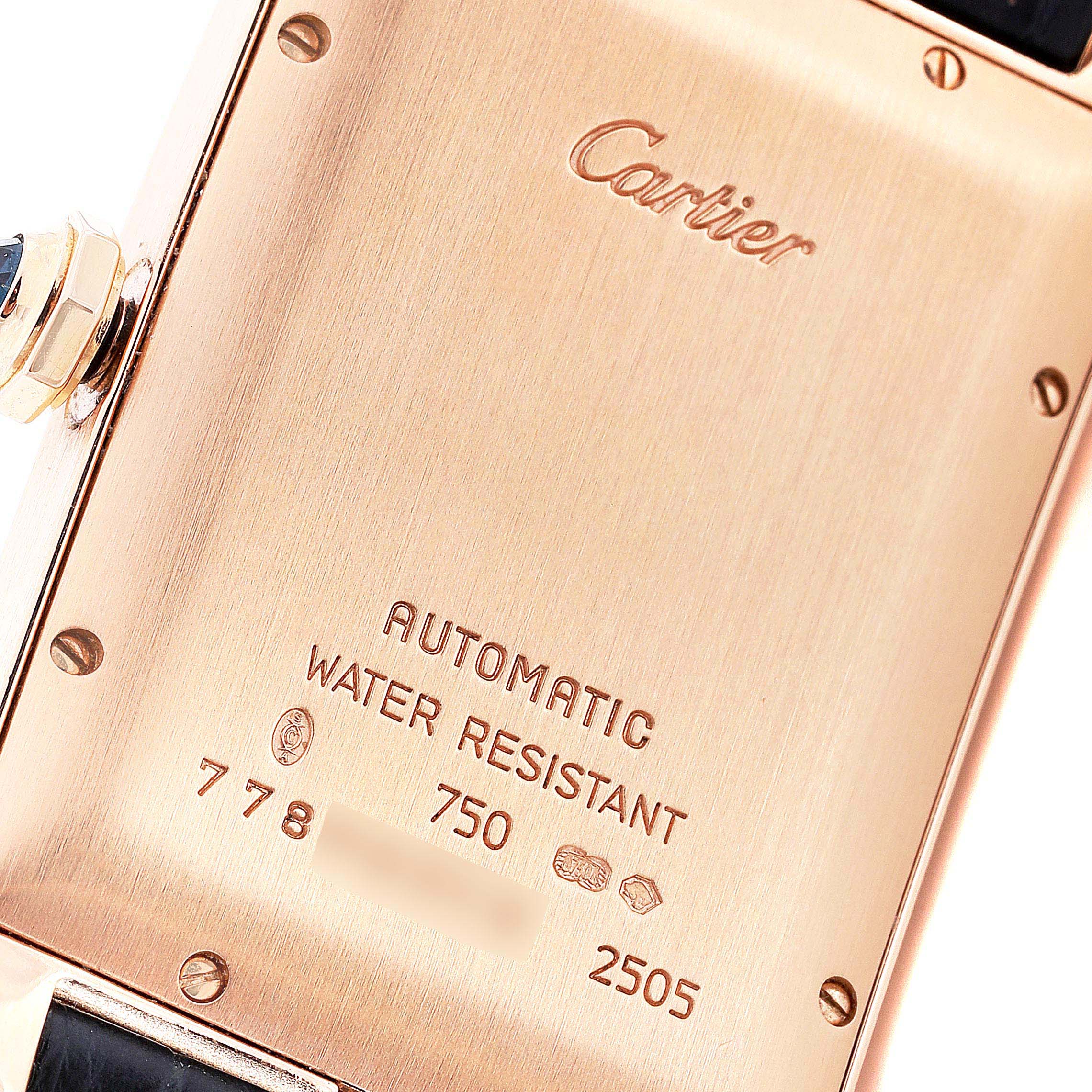 This image shows the back casing of the Cartier Tank Americaine 2505 Men's Rose Gold Silver Dial 2505 Men's Rose Gold Silver Dial watch, highlighting its engraved details and screws.