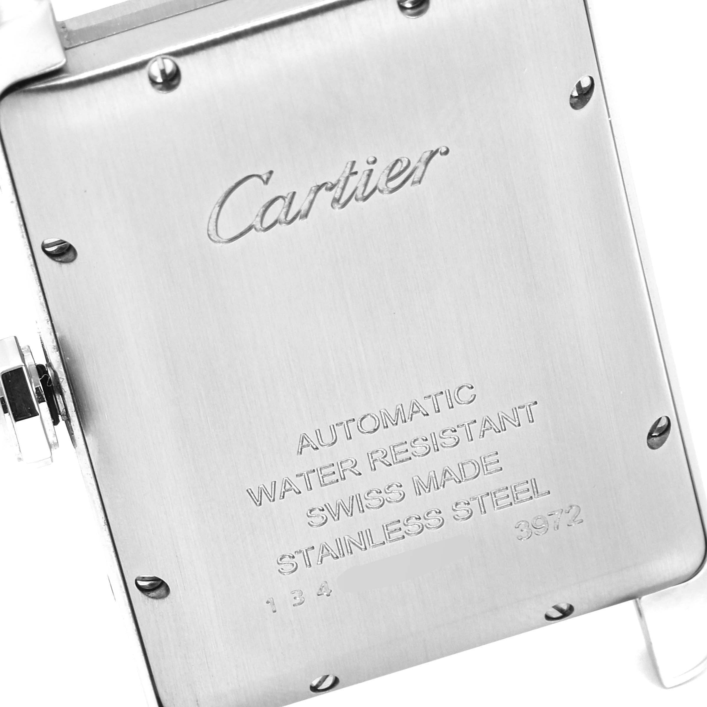 This image shows the back case of the Cartier Tank Américaine watch, highlighting the brand's engraving and technical specifications.