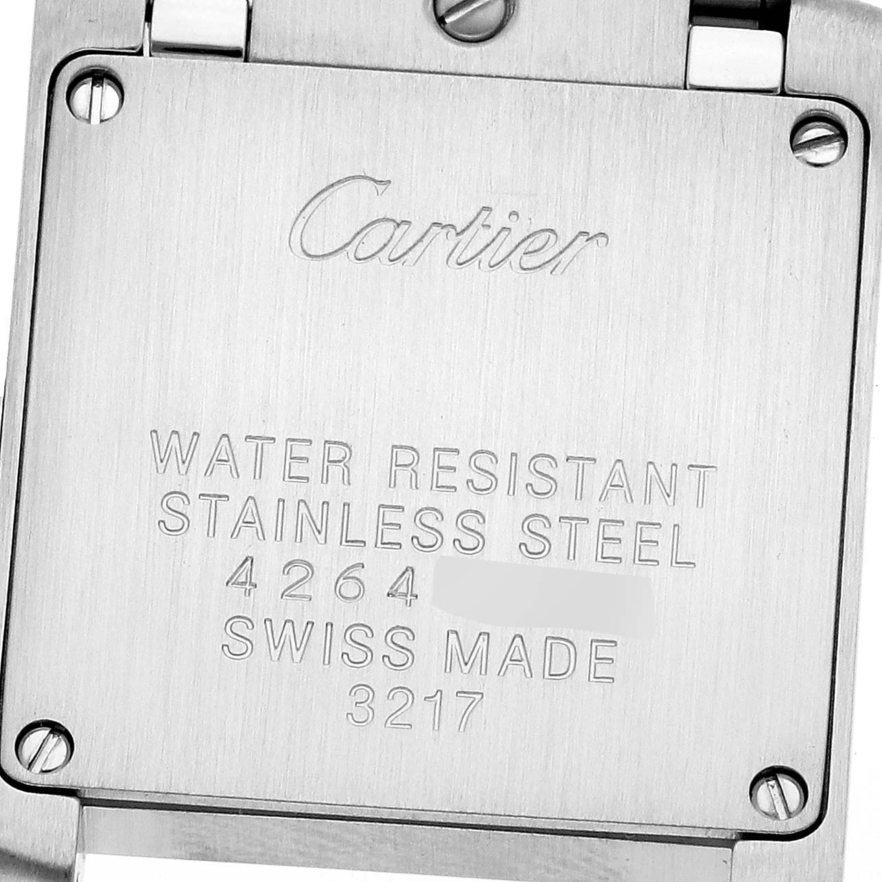 The image shows the back casing of the Cartier Tank Francaise WE110004 Women's Steel and Gold (two tone) Silver Dial WE110004 Women's Steel and Gold (two tone) Silver Dial watch, displaying its engravings and screws.