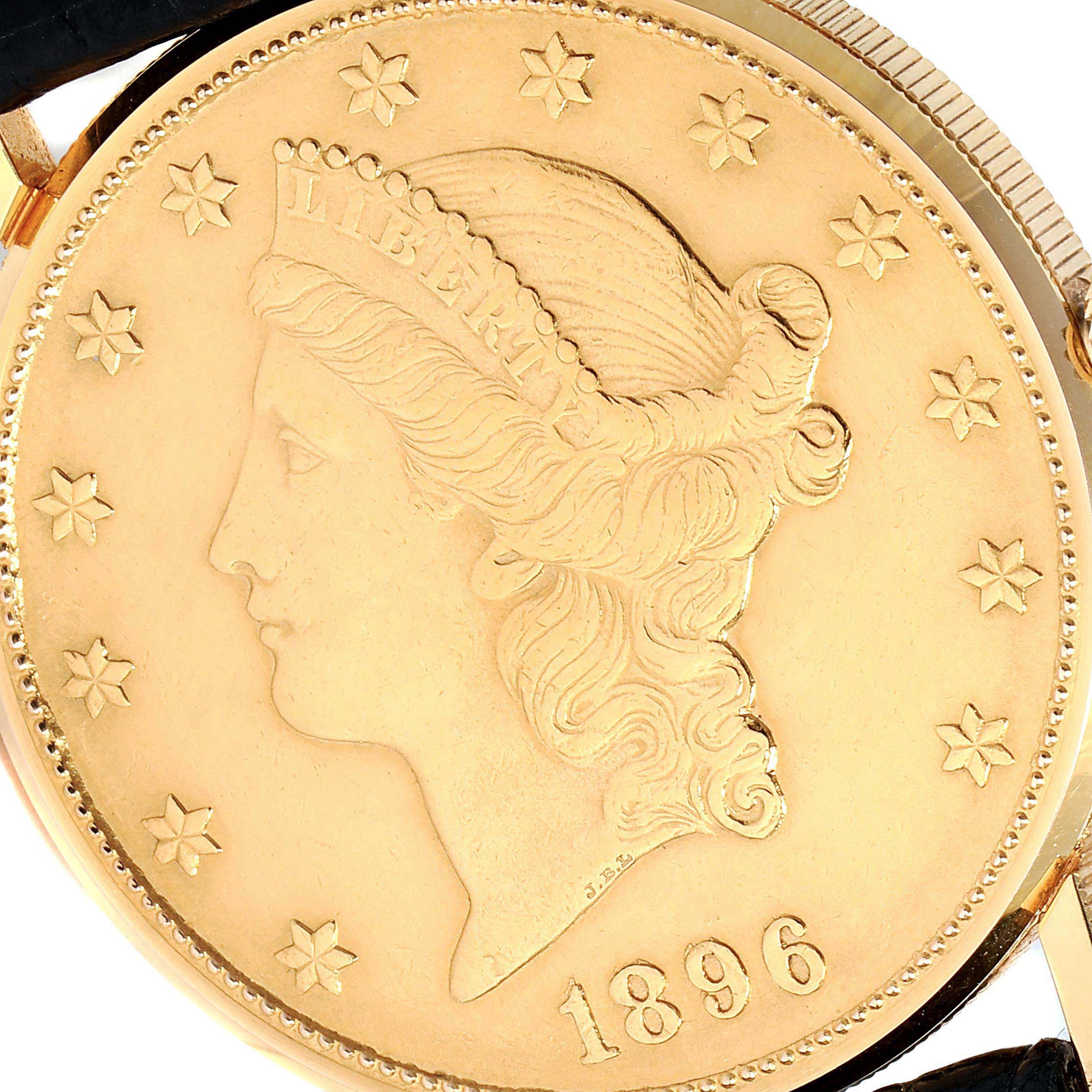 This close-up image shows the face of the Coin Watch model by Corum, featuring an 1896 coin design.