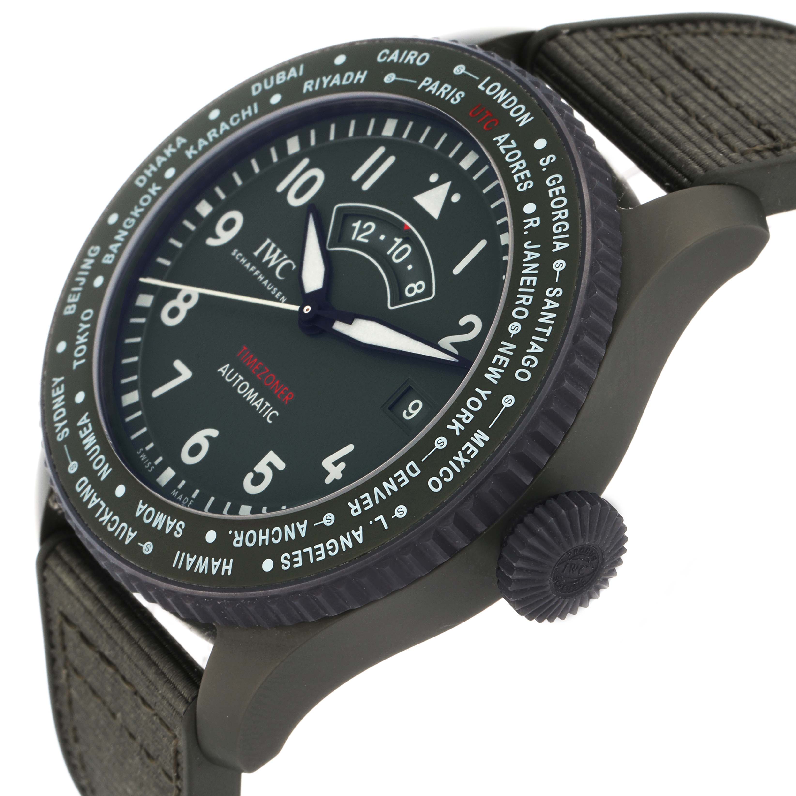 The IWC Pilot IW395601 Men
s Ceramic Green Dial watch is shown from a side angle, highlighting the dial, bezel with city names, crown, and strap attachment.
