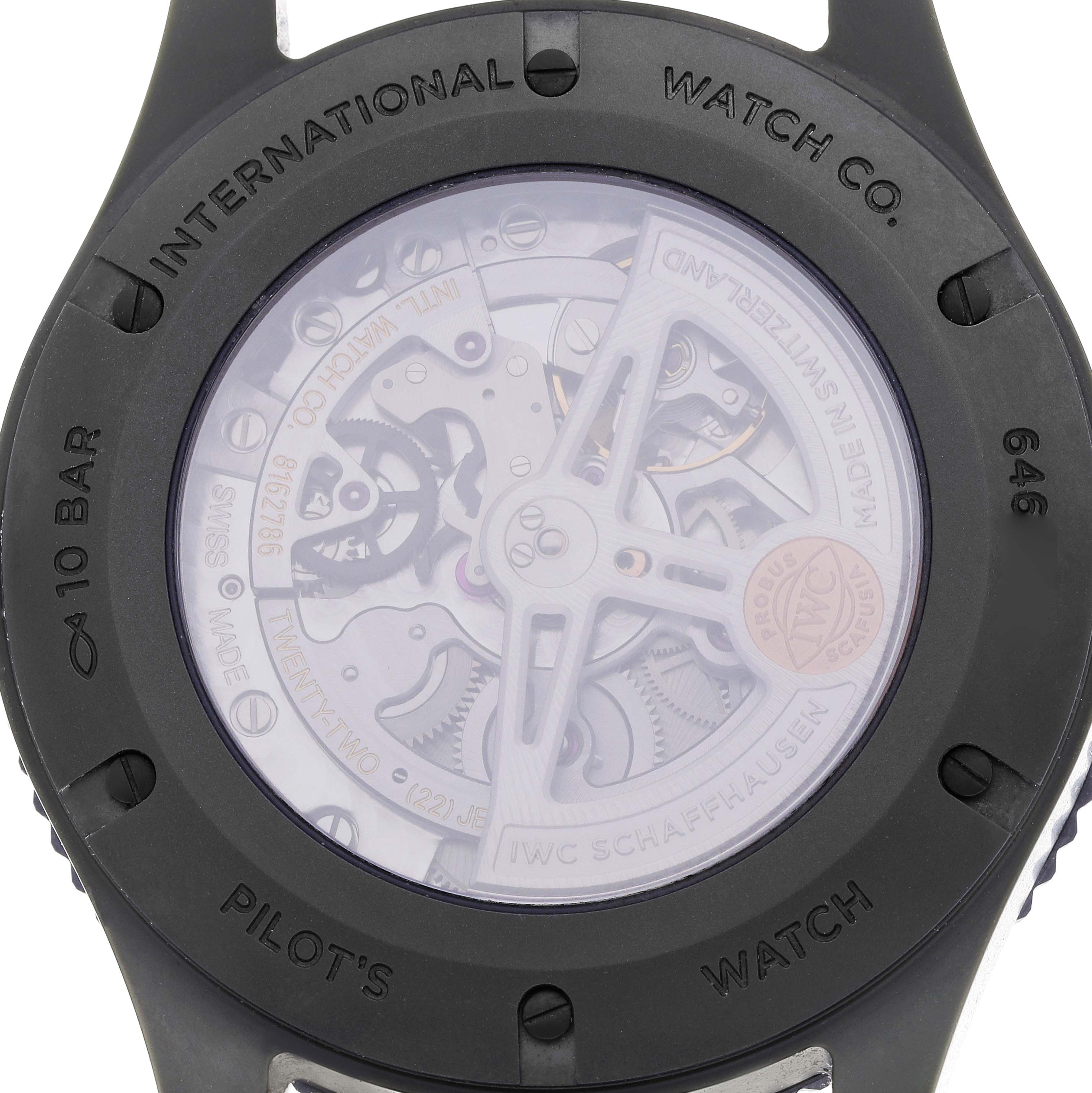 The image shows the back of the IWC Pilot IW395601 Men
s Ceramic Green Dial watch, showcasing its inner mechanical components through a transparent case.