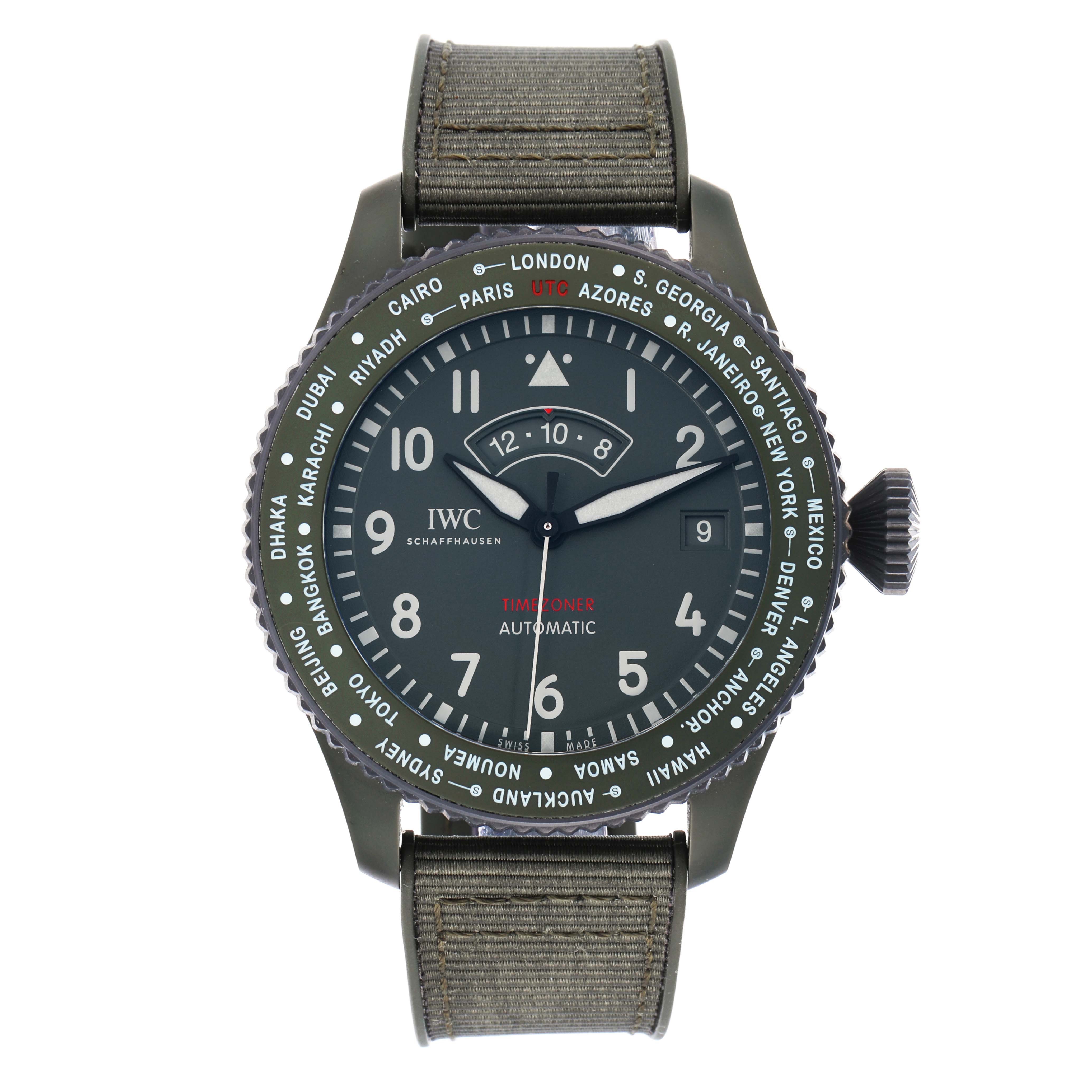The IWC Pilot IW395601 Men
s Ceramic Green Dial watch is shown from the front, displaying its dial, bezel with city names, and fabric strap.
