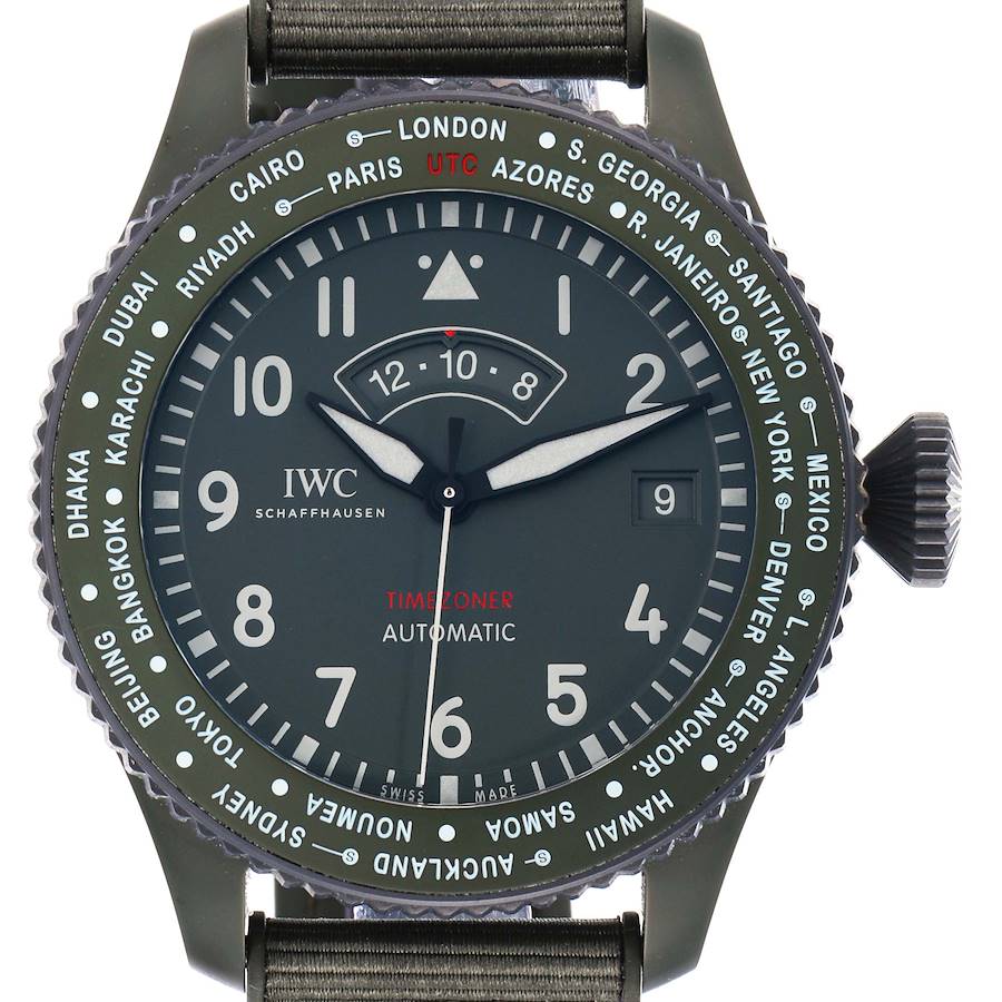 The image shows a front view of the IWC Pilot IW395601 Men's Ceramic Green Dial watch, detailing the dial, bezel with city names, and crown.
