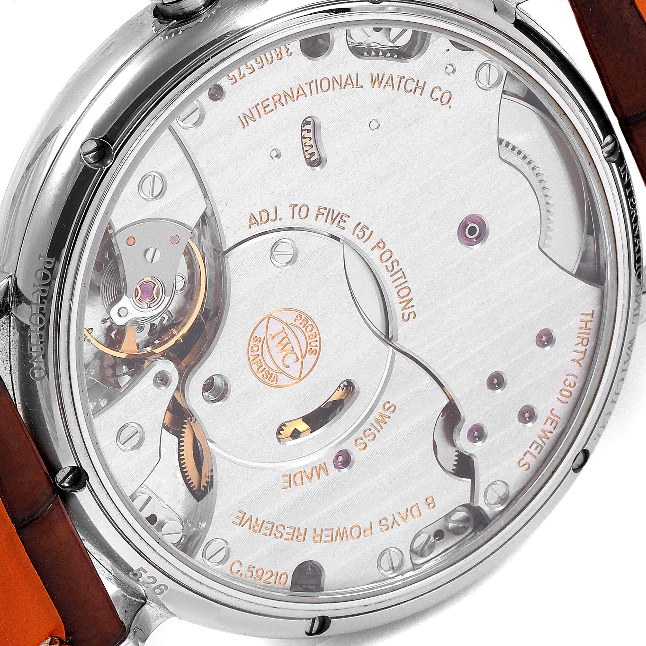 The image shows the back of an IWC Portofino IW510103 Men's Stainless Steel Silver Dial IW510103 Men's Stainless Steel Silver Dial watch, highlighting its intricate internal mechanism and components.