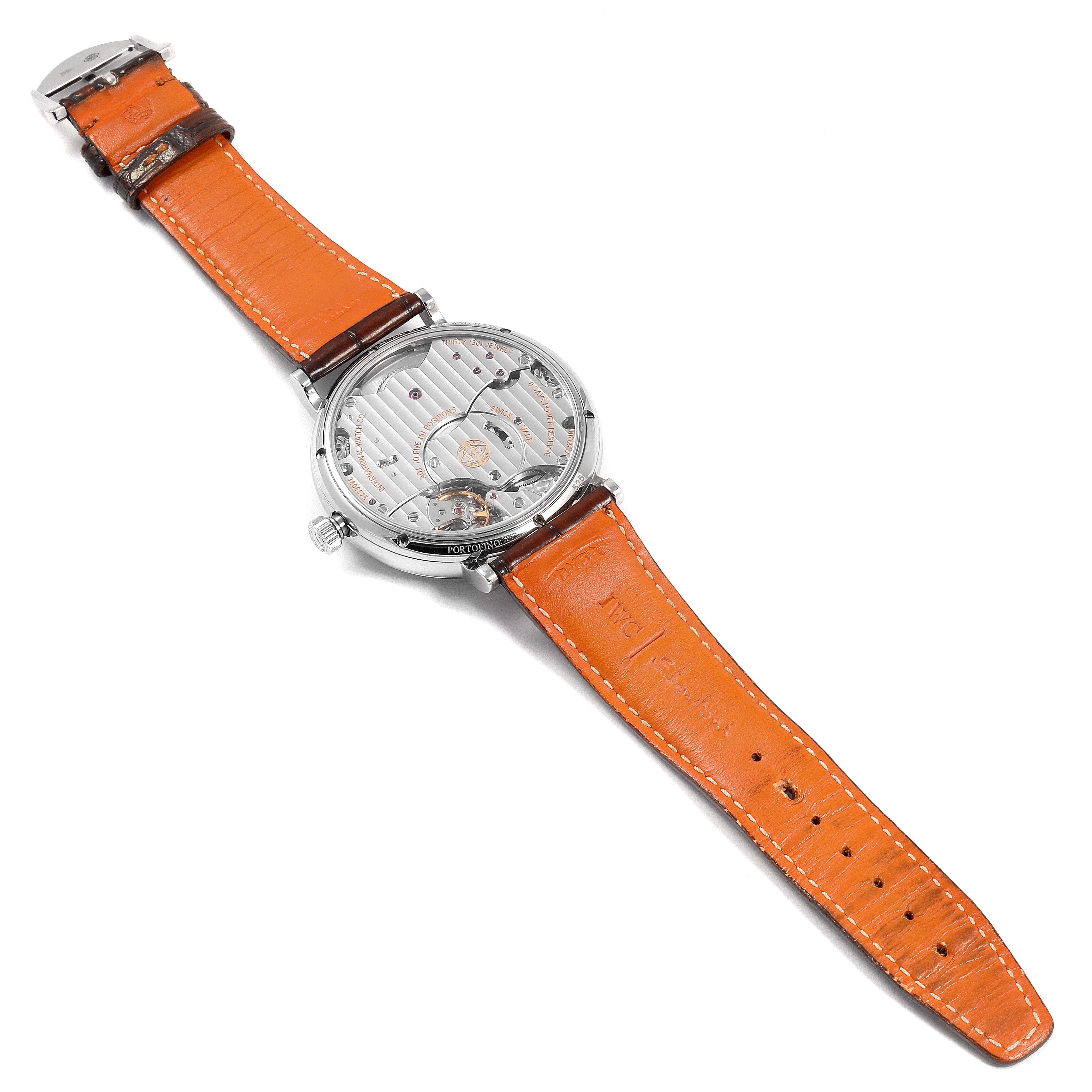 The image shows the back view of the IWC Portofino IW510103 Men's Stainless Steel Silver Dial IW510103 Men's Stainless Steel Silver Dial watch with an orange leather strap displayed fully.