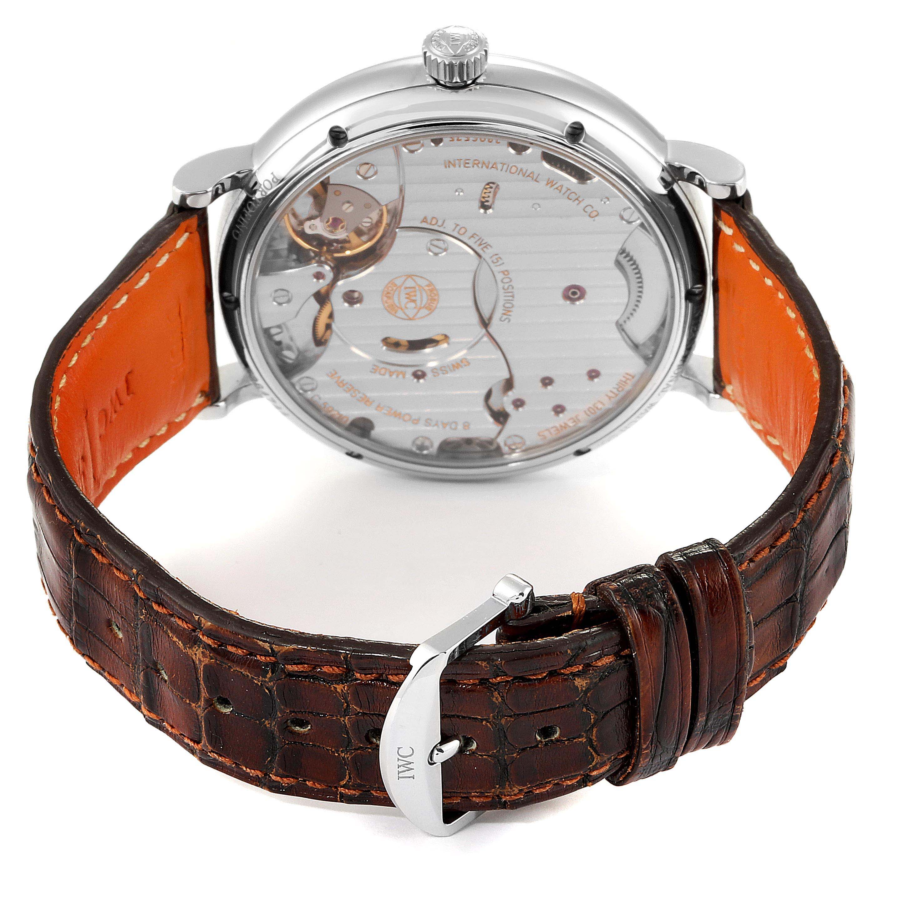 The image shows the back view of the IWC Portofino IW510103 Men's Stainless Steel Silver Dial IW510103 Men's Stainless Steel Silver Dial watch, highlighting the transparent case back and brown leather strap.