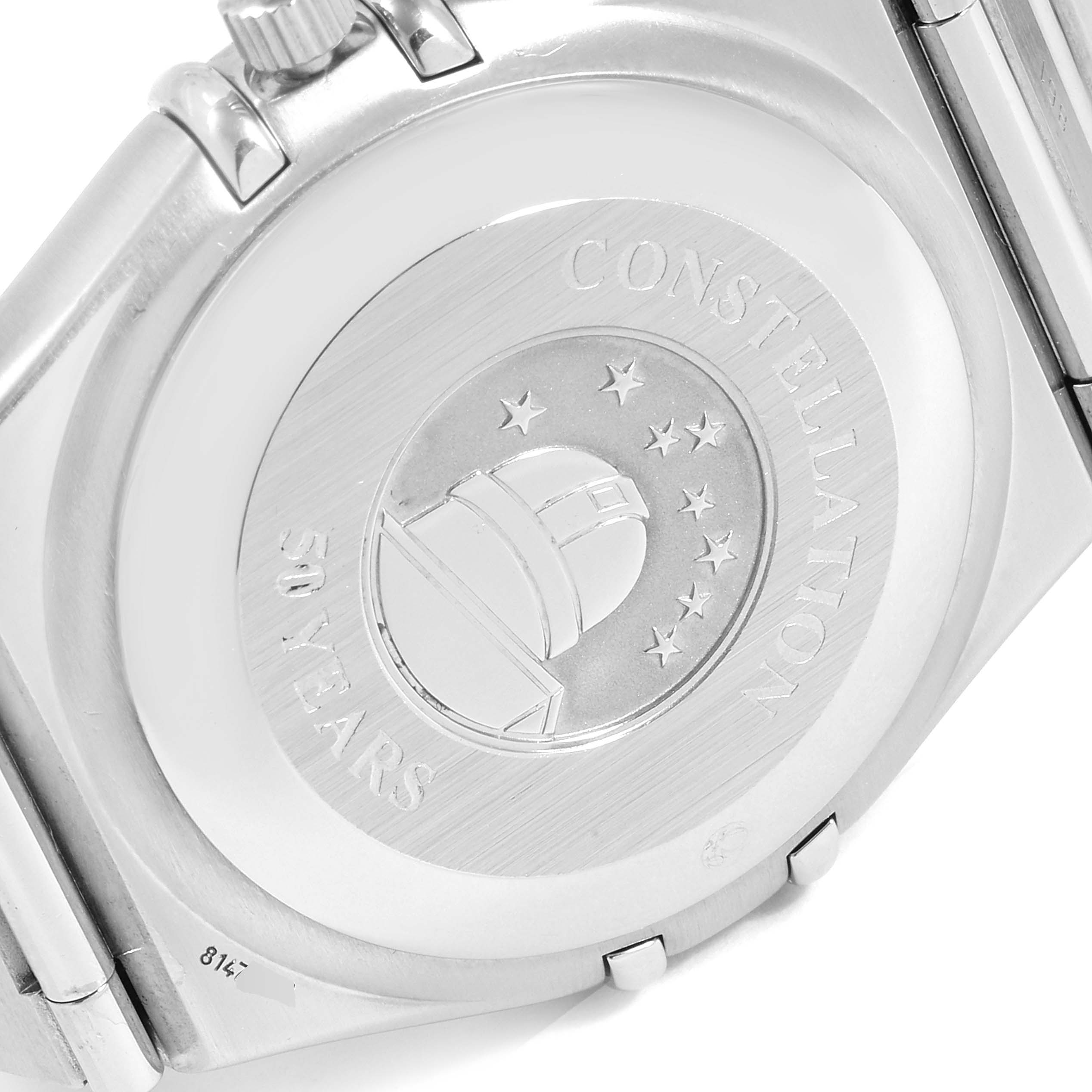 The image shows the back case of an Omega Constellation 1504.35.00 Men's Stainless Steel Silver Dial 1504.35.00 Men's Stainless Steel Silver Dial watch, featuring an observatory with stars and "50 Years" engraving.