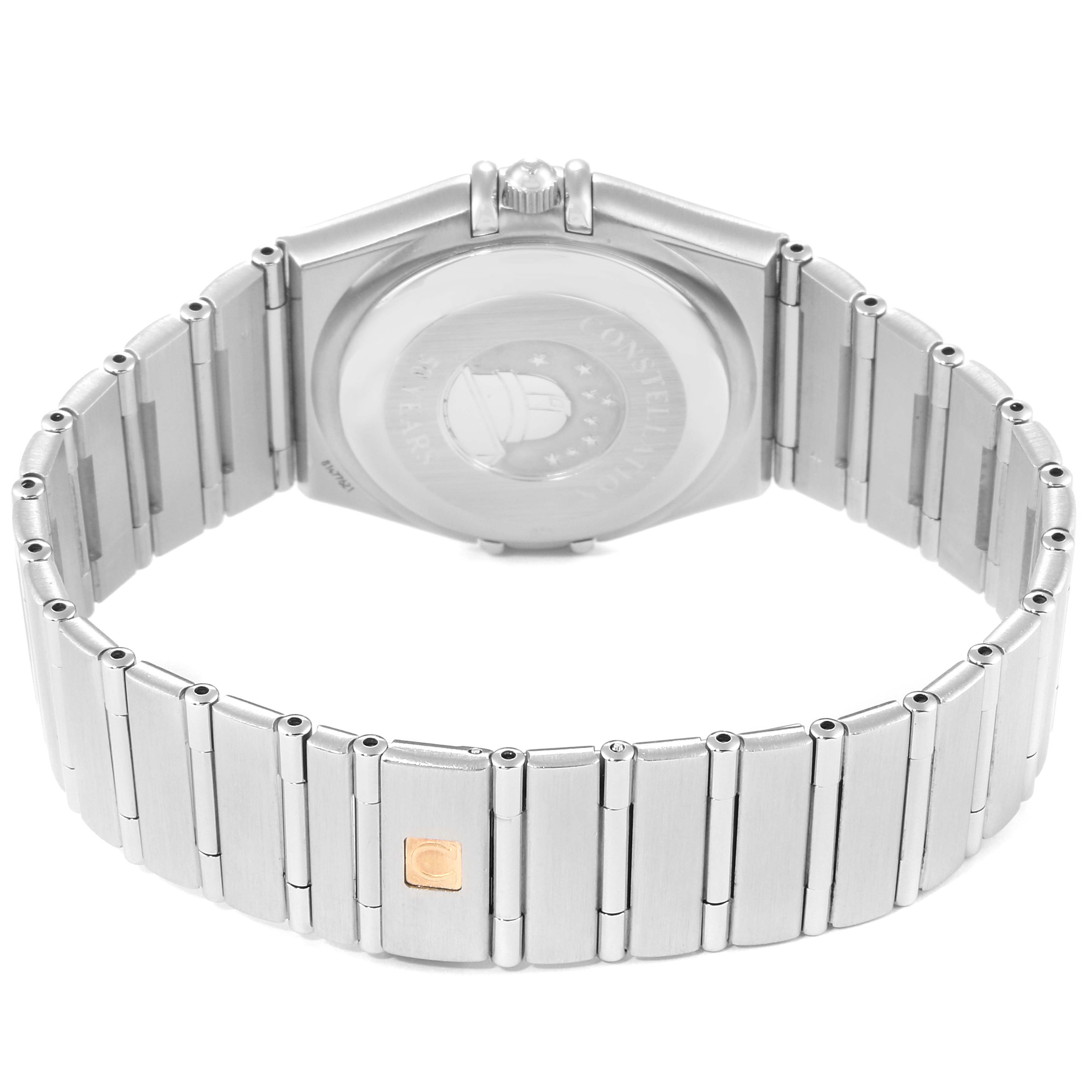 The image shows the back view of an Omega Constellation 1504.35.00 Men's Stainless Steel Silver Dial 1504.35.00 Men's Stainless Steel Silver Dial watch, highlighting its case back, crown, and metal bracelet.