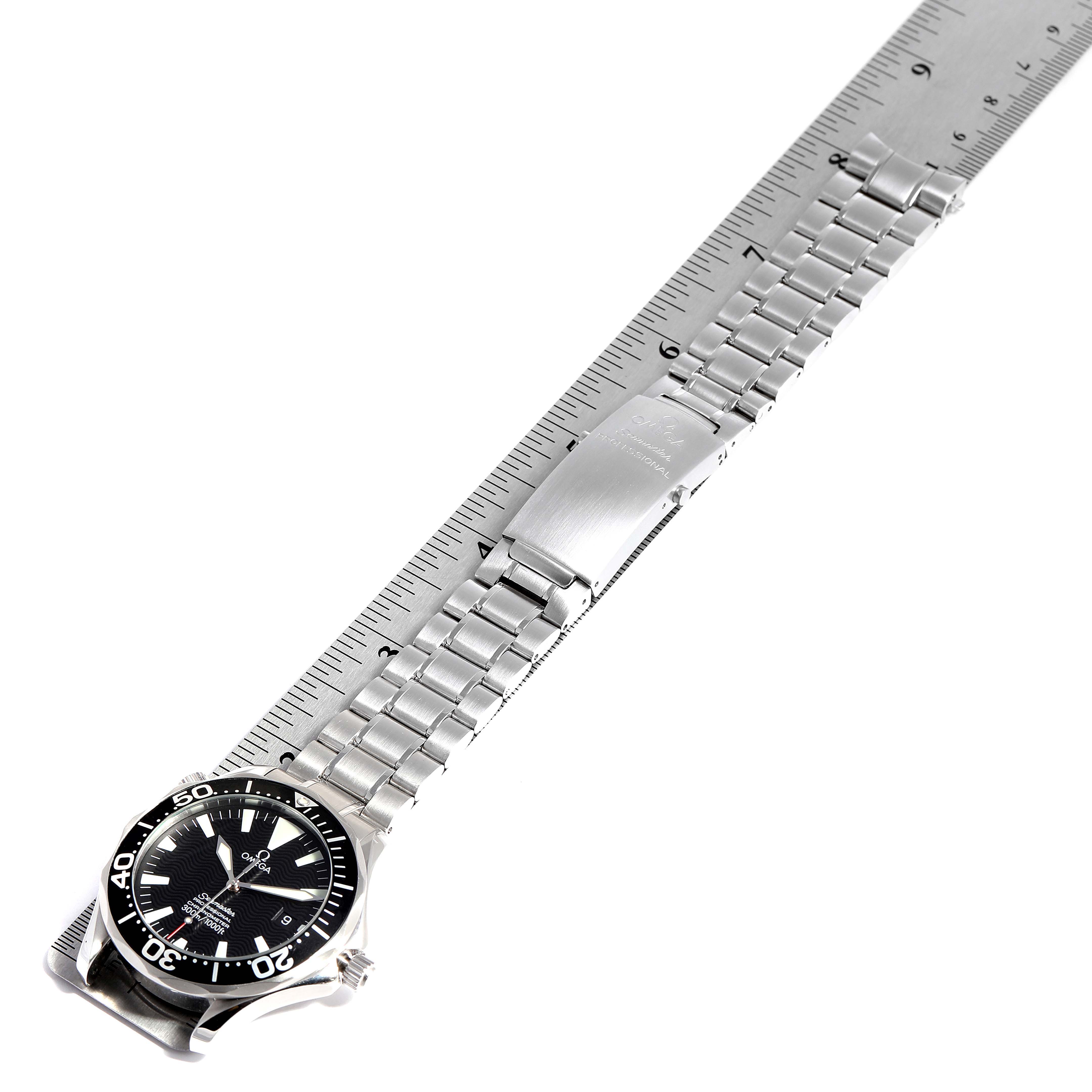 The image shows an Omega Seamaster 2254.50.00 Men's Stainless Steel Black Dial 2254.50.00 Men's Stainless Steel Black Dial watch laid flat with the face and metal bracelet visible, alongside a ruler.
