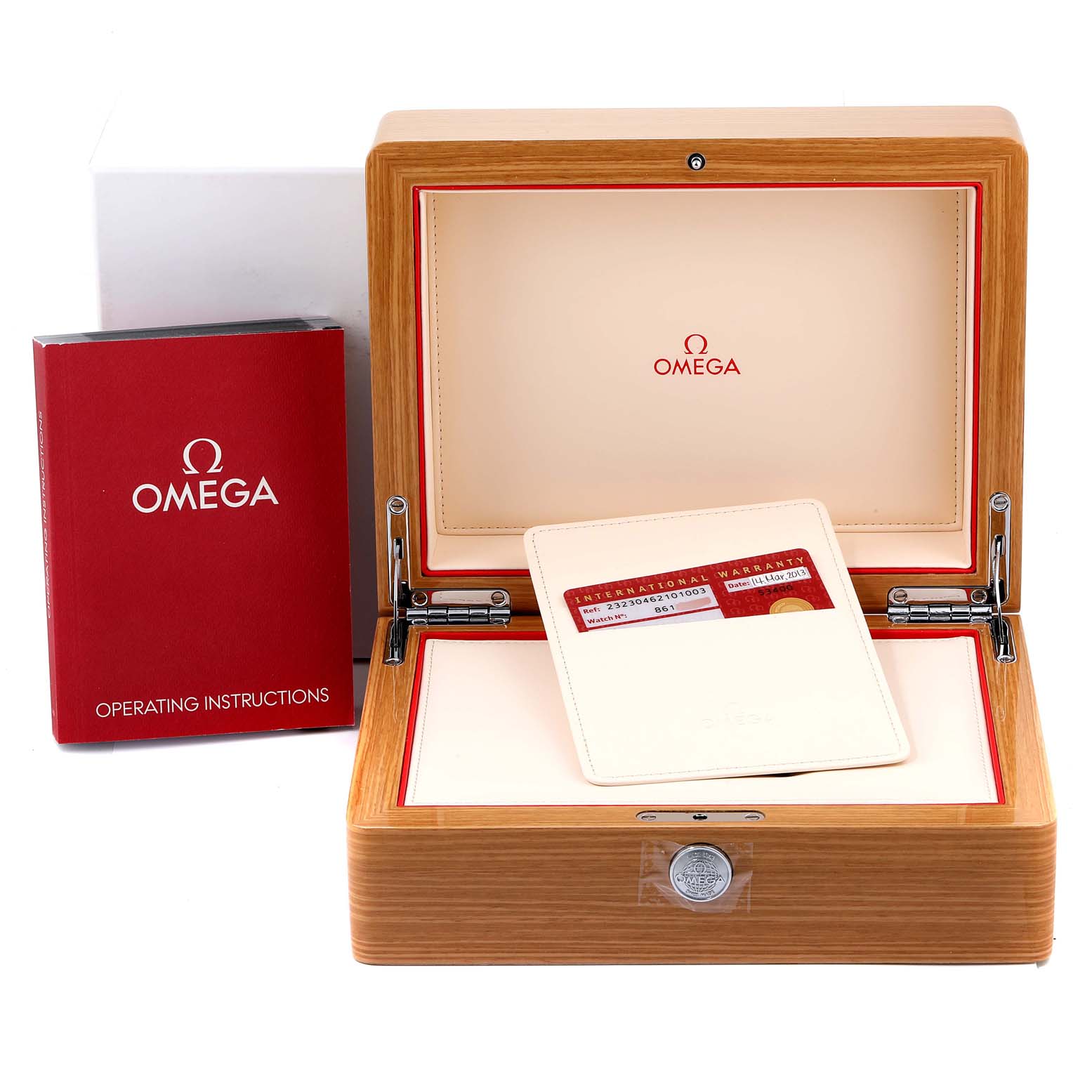 This image shows the wooden storage box, operating instructions, and warranty card for an Omega Seamaster 232.30.46.21.01.003 Men's Stainless Steel Black Dial 232.30.46.21.01.003 Men's Stainless Steel Black Dial model watch.