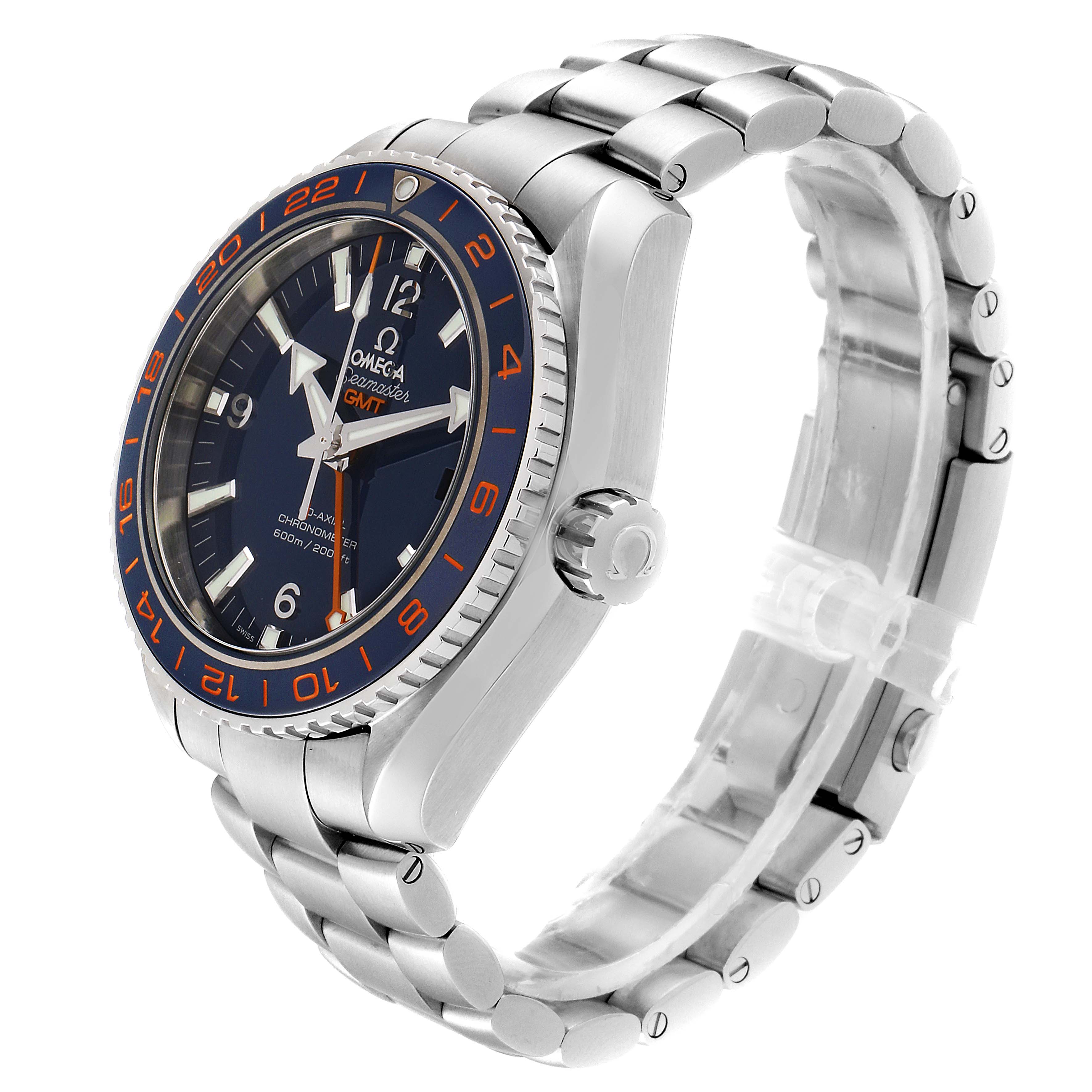 The image shows the Omega Planet Ocean 232.30.44.22.03.001 Men's Stainless Steel Blue Dial 232.30.44.22.03.001 Men's Stainless Steel Blue Dial GMT watch from a slight side angle, highlighting the dial, bezel, crown, and metal bracelet.