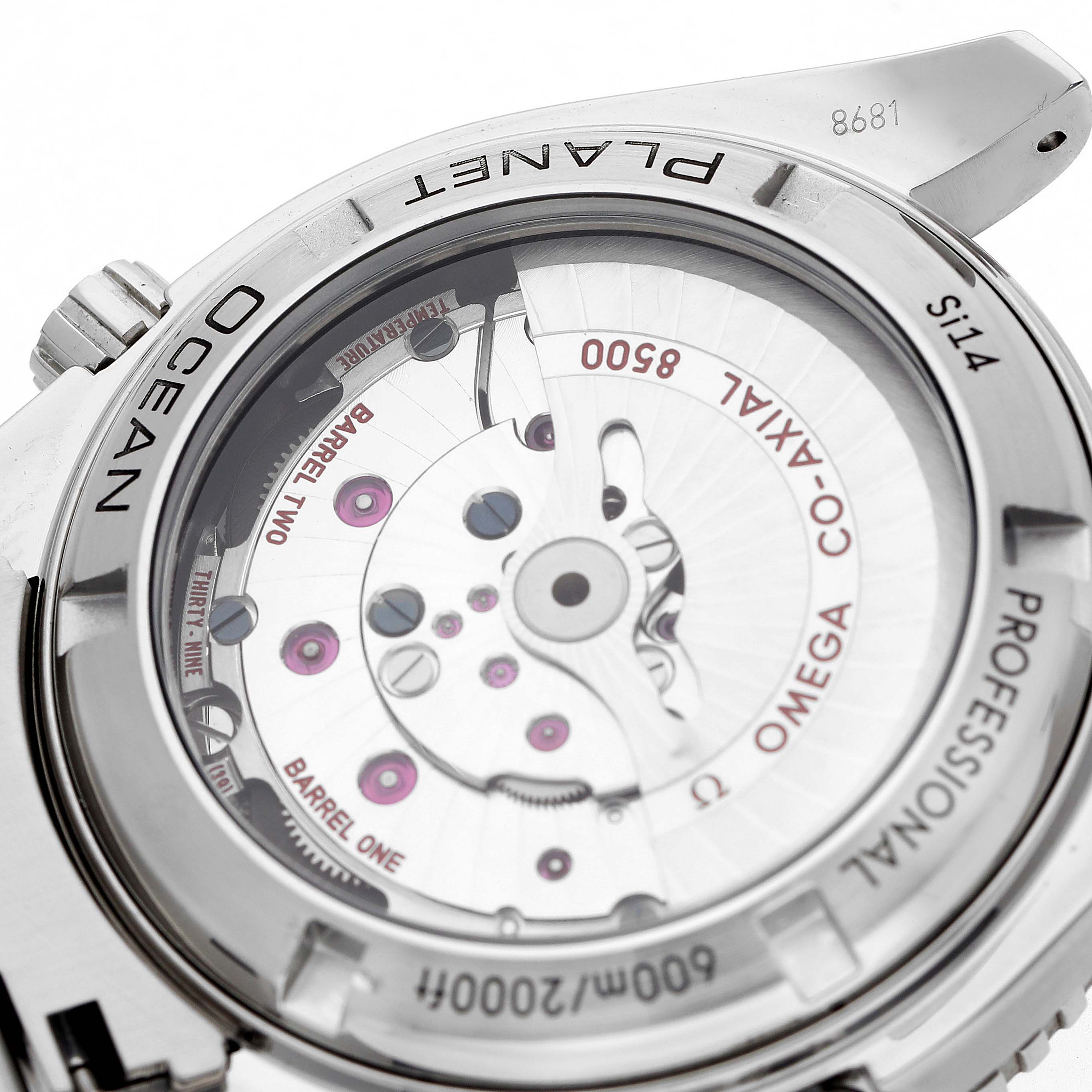 The image shows the back of an Omega Planet Ocean 232.30.42.21.01.001 Men
s Stainless Steel Black Dial, highlighting the movement and inner mechanics through a transparent case back.