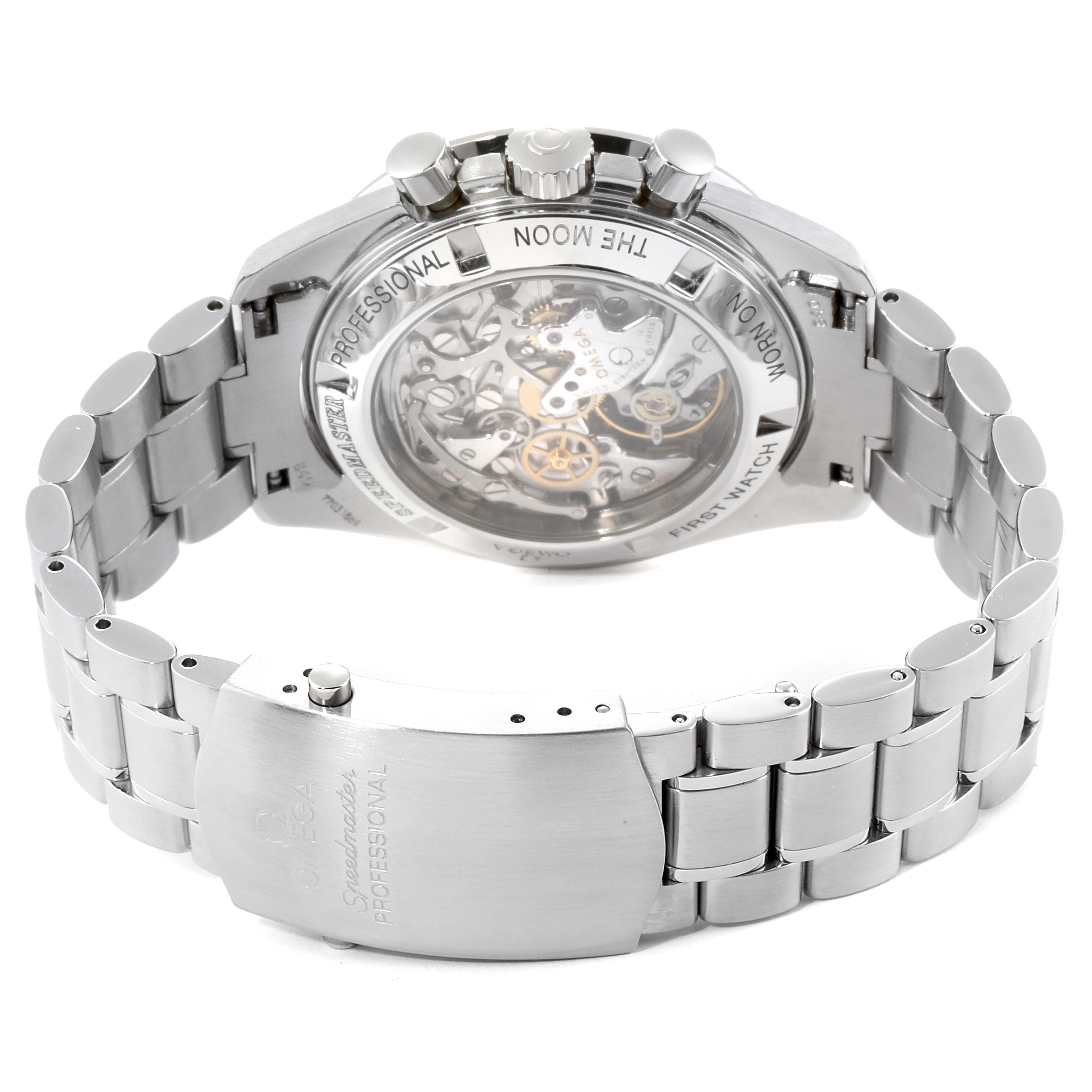 The image shows the case back and bracelet clasp of the Omega Speedmaster 3572.50.00 Men
s Stainless Steel Black Dial 3572.50.00 Men
s Stainless Steel Black Dial watch at an angle that reveals its transparent case back and inner mechanics.