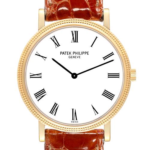 This is a frontal view of the Patek Philippe Calatrava watch, showing the watch face, Roman numeral markers, and a portion of the leather strap.