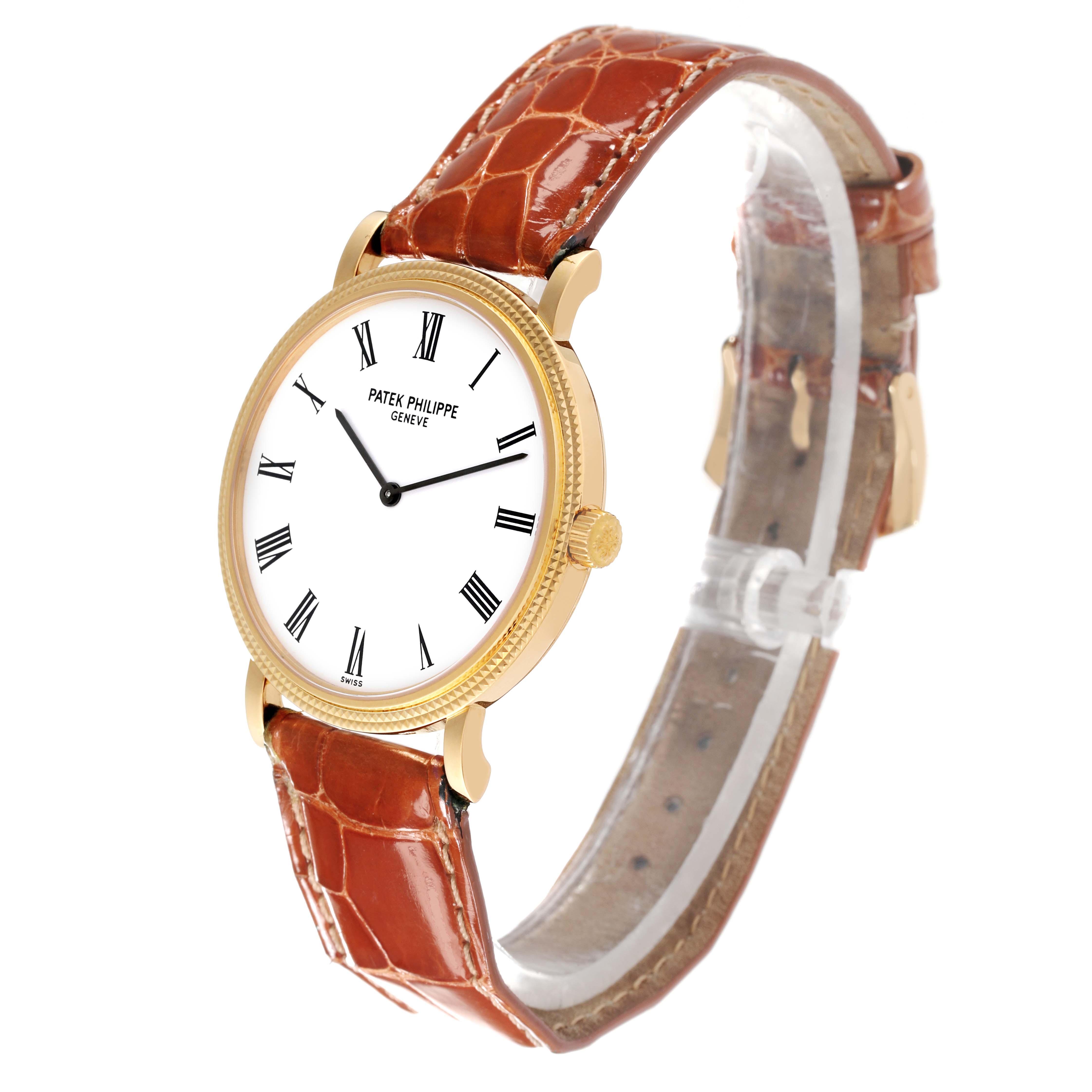 This image shows a Patek Philippe Calatrava 5120J-001 Men's Yellow Gold White Dial 5120J-001 Men's Yellow Gold White Dial watch, highlighting the round face, Roman numerals, gold case, and brown leather strap.