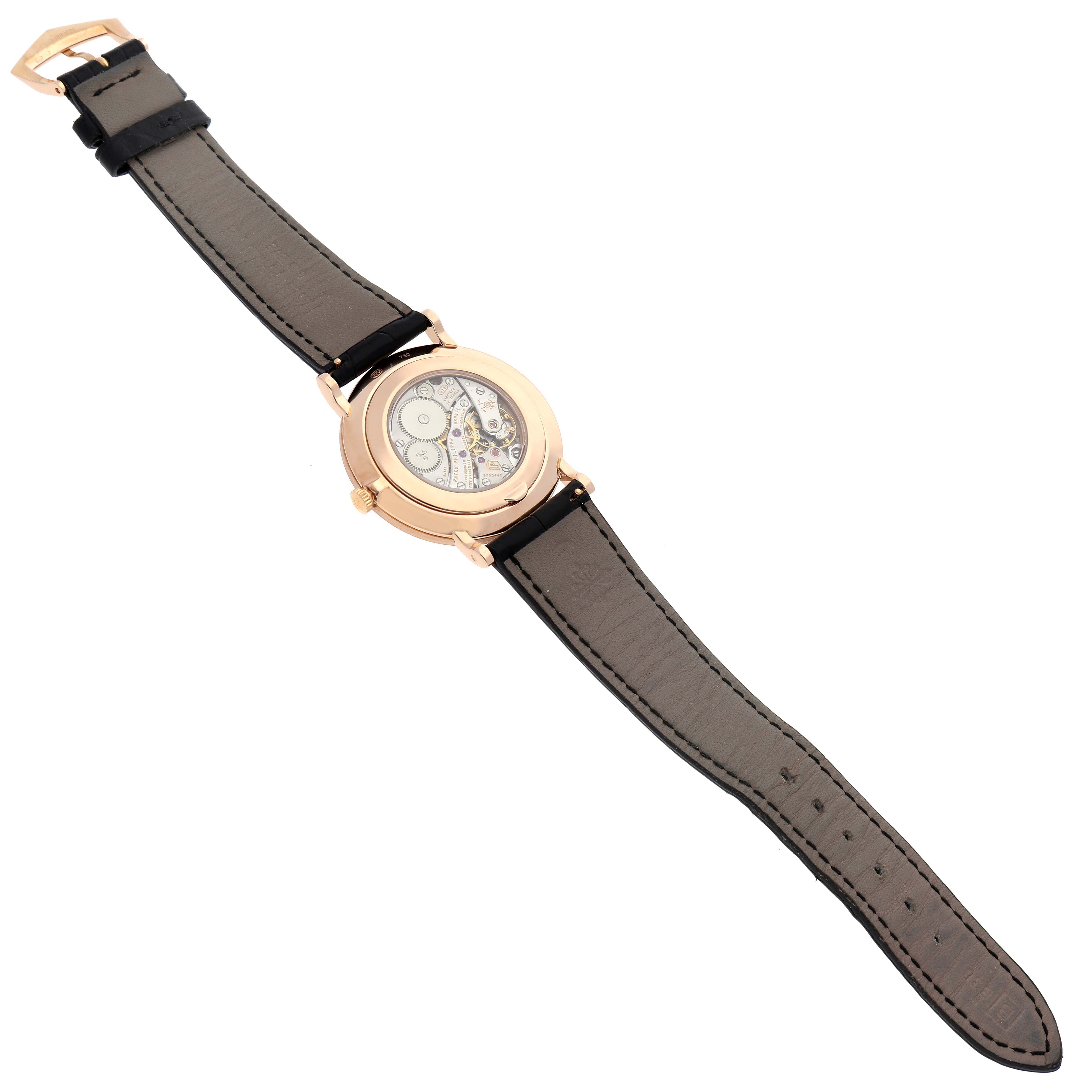 The image shows the back view of a Patek Philippe Calatrava 5119R-001 Men
s Rose Gold White Dial 5119R-001 Men
s Rose Gold White Dial watch, highlighting its movement through the case back.