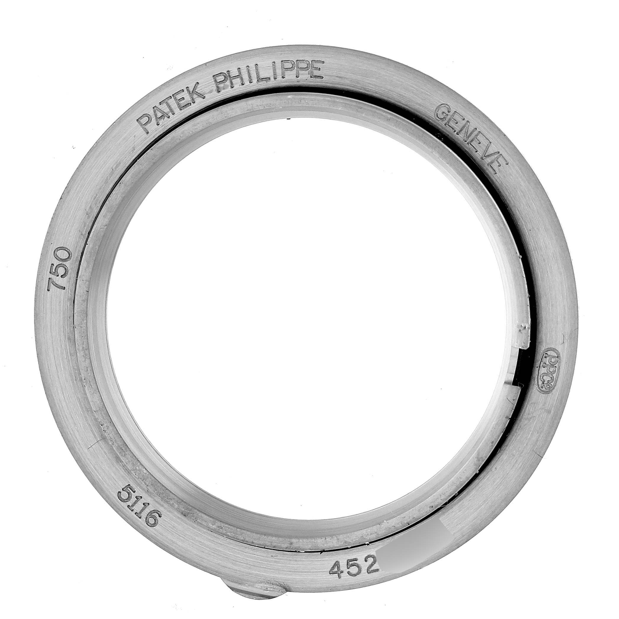 The image shows the bezel of a Patek Philippe Calatrava 5116G Men
s White Gold White Dial 5116G Men
s White Gold White Dial model watch, viewed from a top-down angle.