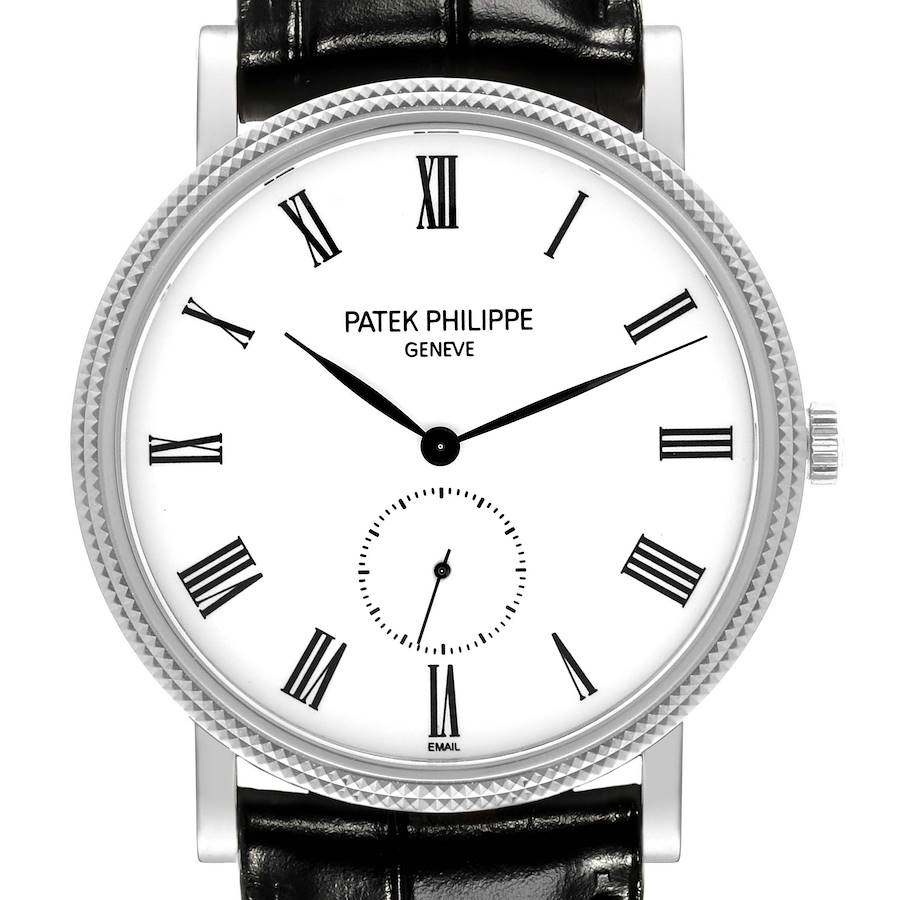 This Patek Philippe Calatrava watch is shown from the front, displaying its face, dial, and part of the leather strap.