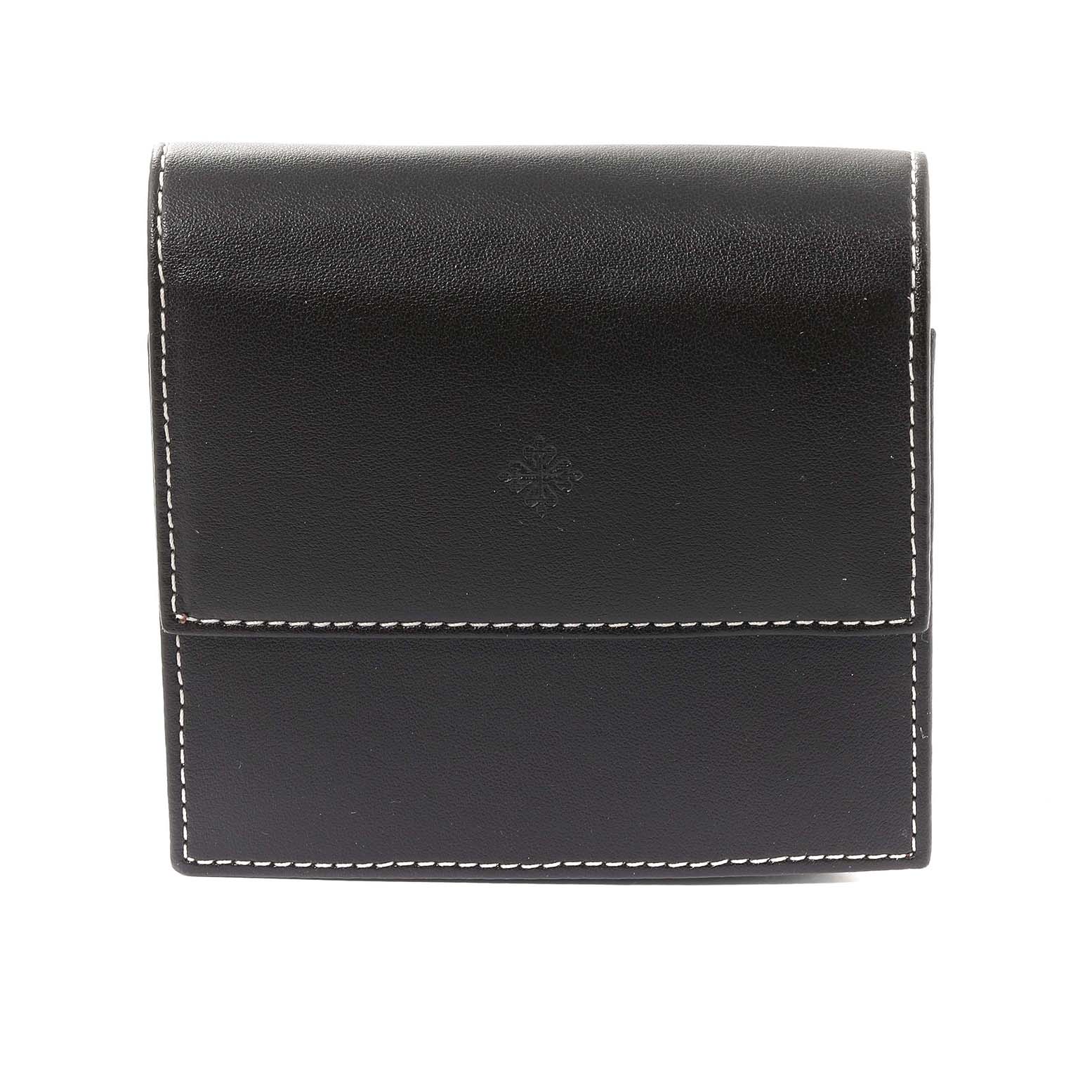 The image shows a black leather case for a Patek Philippe Calatrava 5116G Men
s White Gold White Dial 5116G Men
s White Gold White Dial watch, featuring white stitching and the brand
s logo.