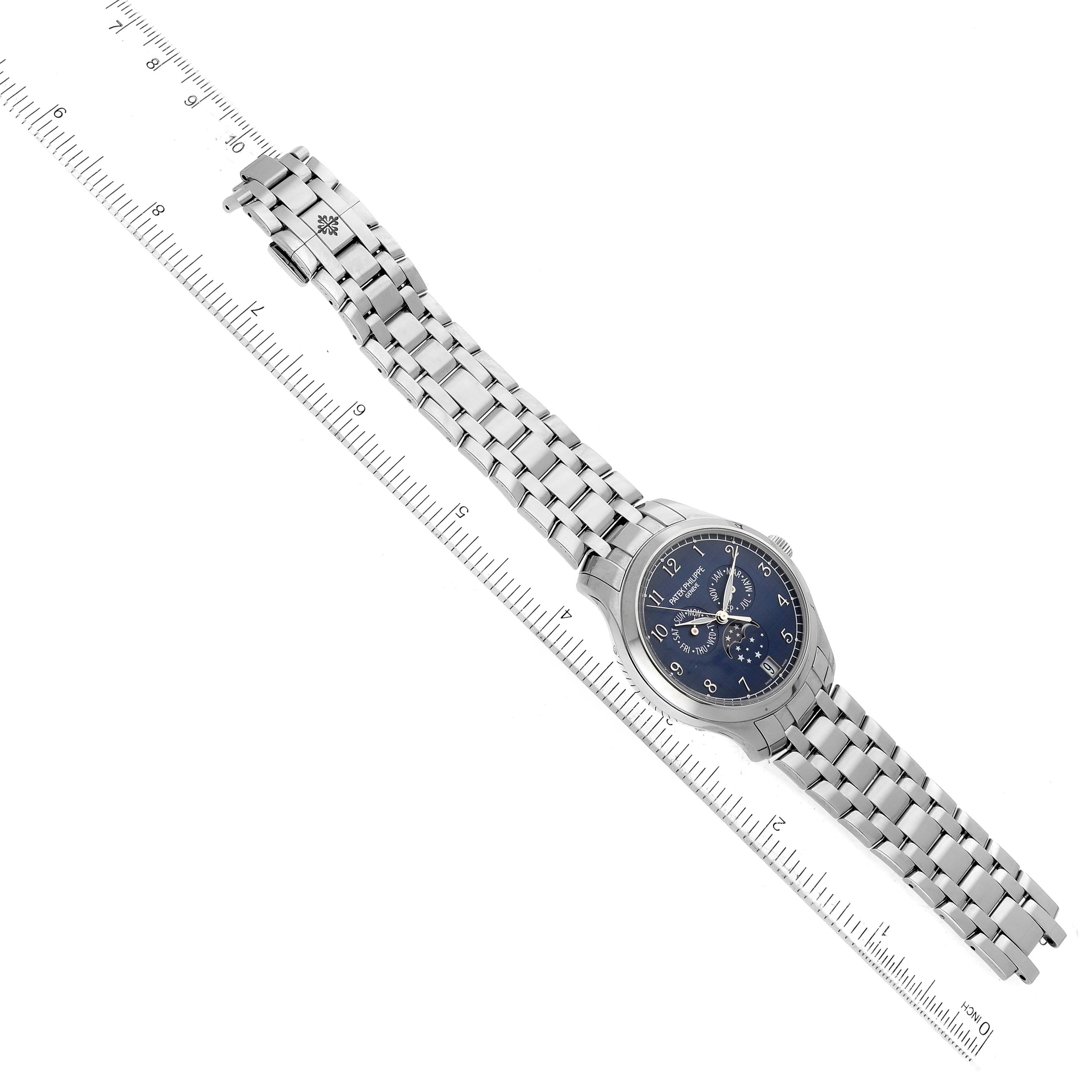 This image shows a Patek Philippe Complications 4947/1A-001 Men's Stainless Steel Blue Dial 4947/1A-001 Men's Stainless Steel Blue Dial model watch from a top-down angle, displaying the full watch face and bracelet.