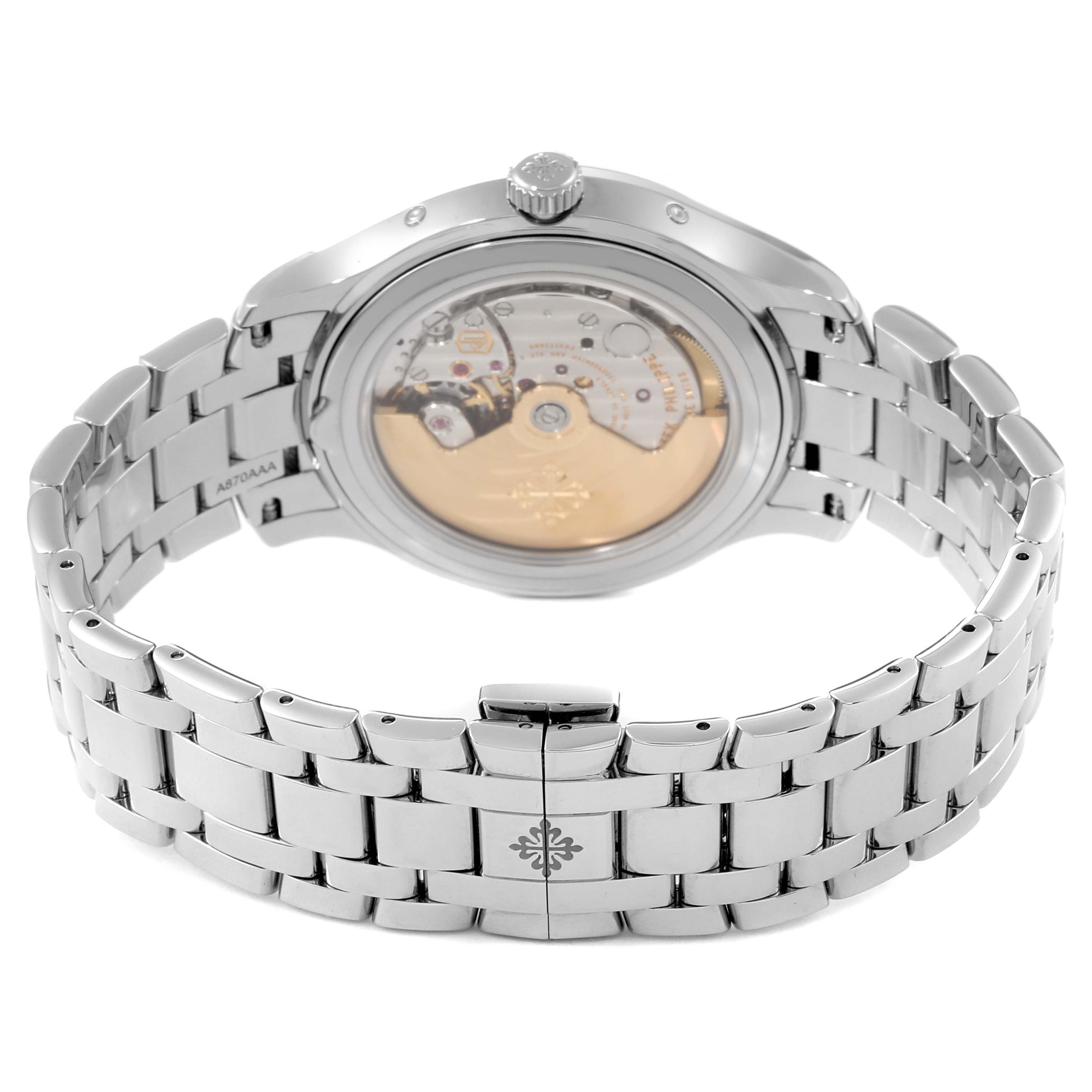 The image shows the back view of the Patek Philippe Complications 4947/1A-001 Men's Stainless Steel Blue Dial 4947/1A-001 Men's Stainless Steel Blue Dial model, displaying the watch's movement and bracelet.