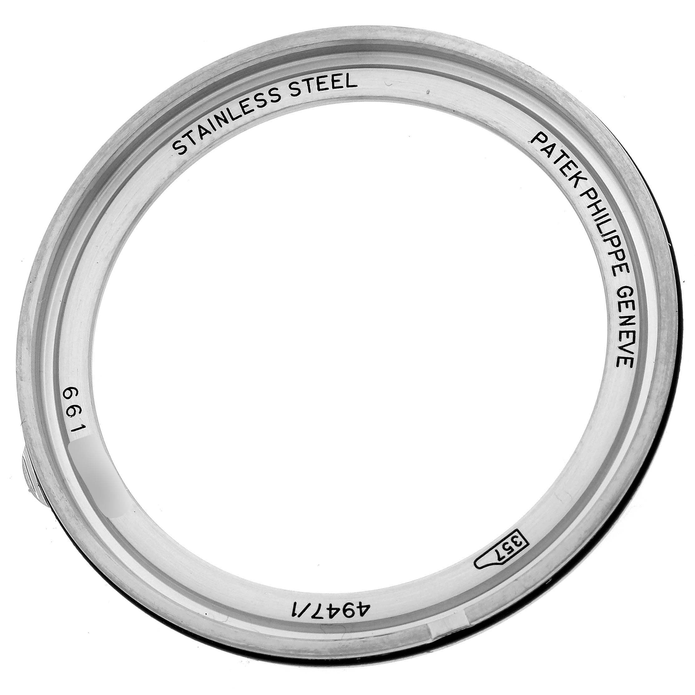 This image shows a stainless steel bezel for the Complications model by Patek Philippe, viewed from the top.