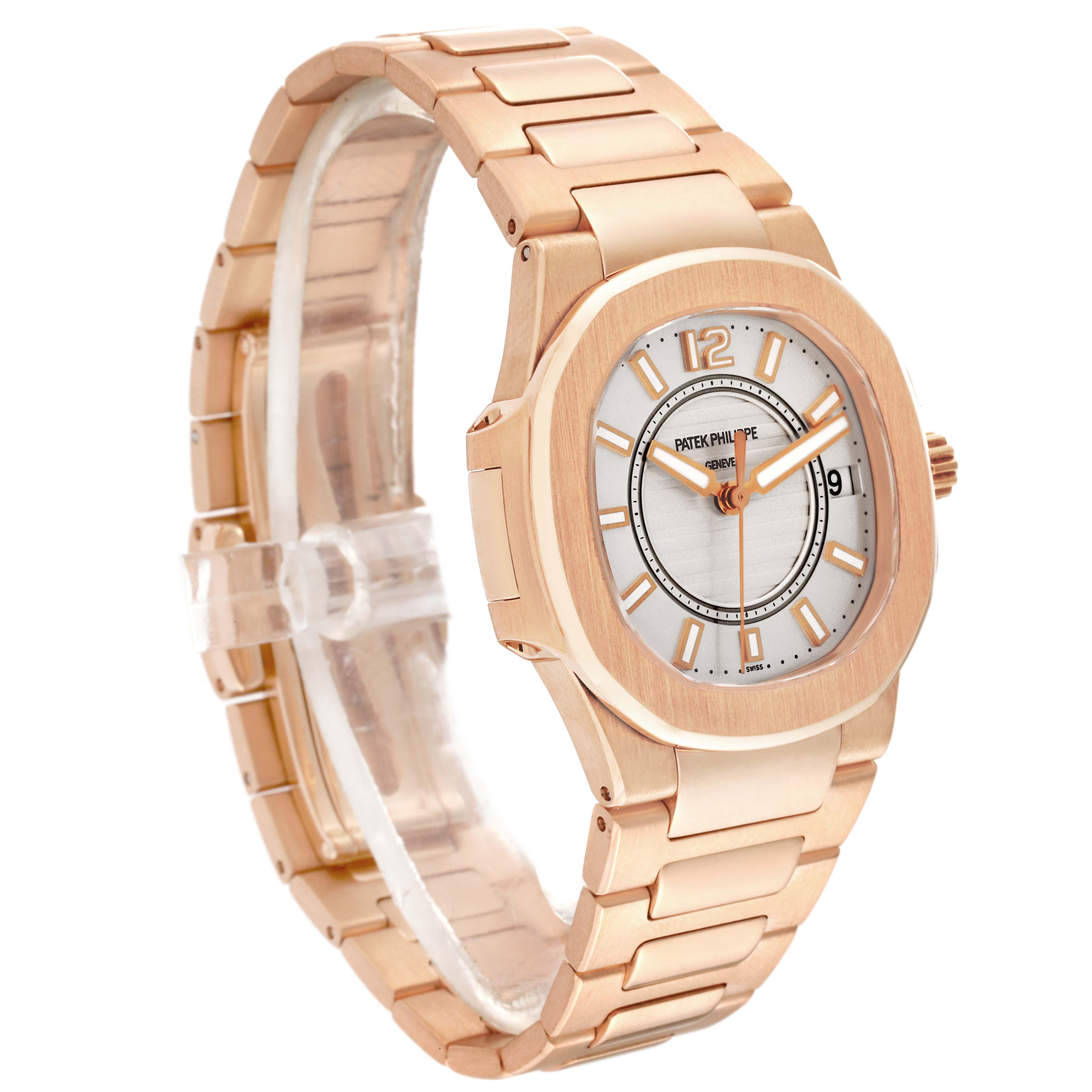 The image shows a Patek Philippe Nautilus 7011/1R-001 Women's Rose Gold Silver Dial 7011/1R-001 Women's Rose Gold Silver Dial watch from an angled view displaying the face and the metal bracelet.