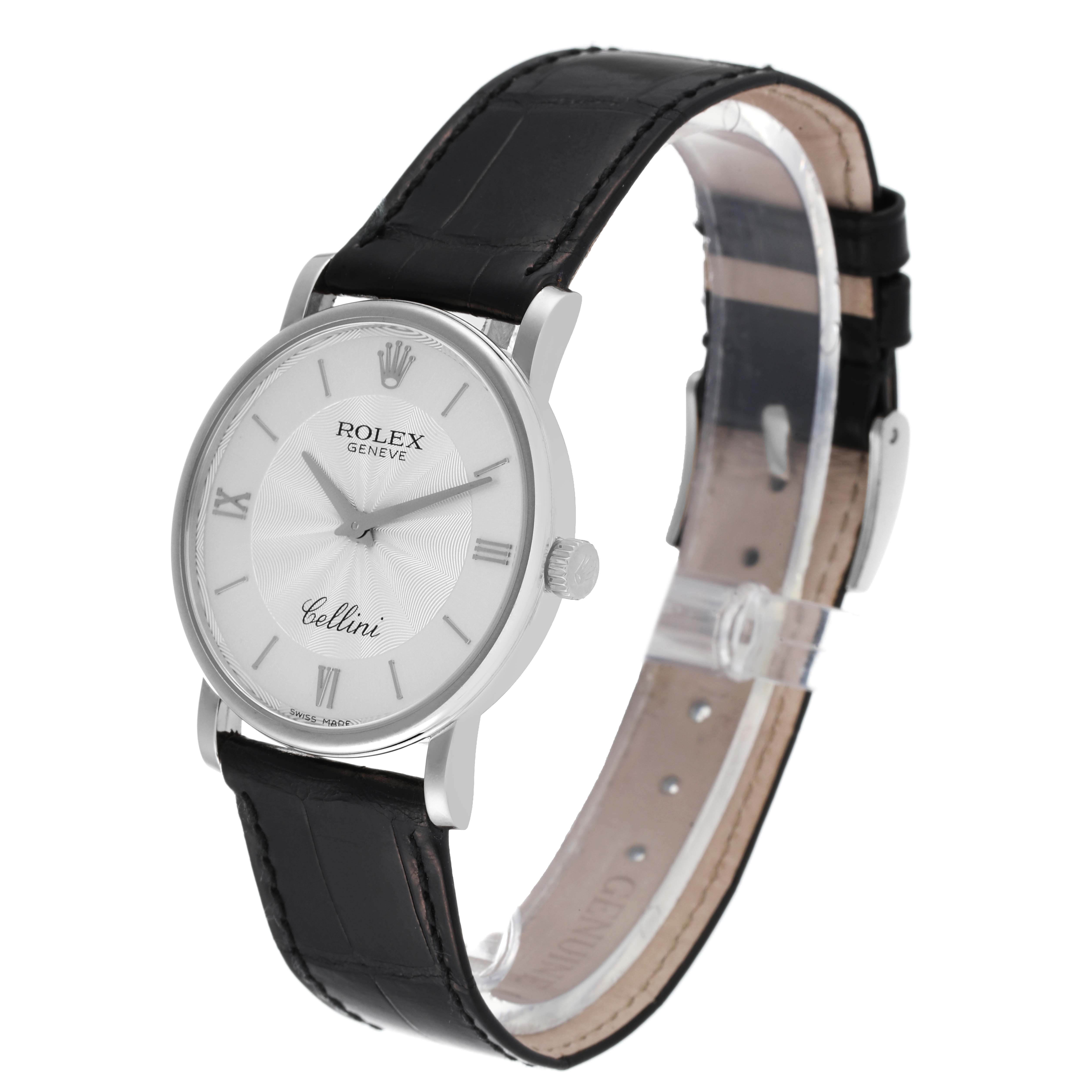 The image shows the Rolex Cellini 5115 Men's White Gold Silver Dial 5115 Men's White Gold Silver Dial watch at an angled side view, featuring its black leather strap, silver case, and white dial.