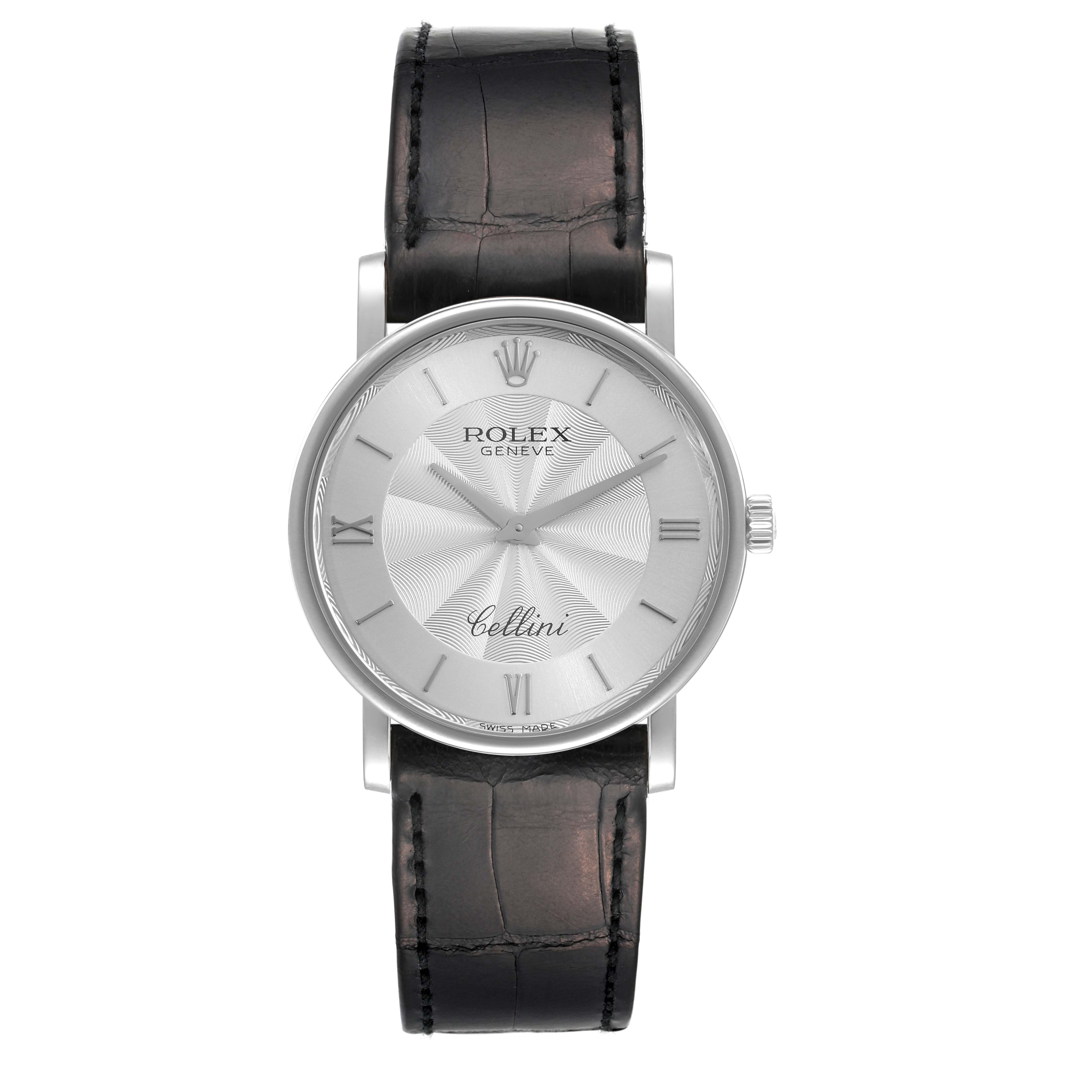 The Rolex Cellini 5115 Men's White Gold Silver Dial 5115 Men's White Gold Silver Dial watch is shown from a top-down angle, highlighting its dial, case, and leather strap.