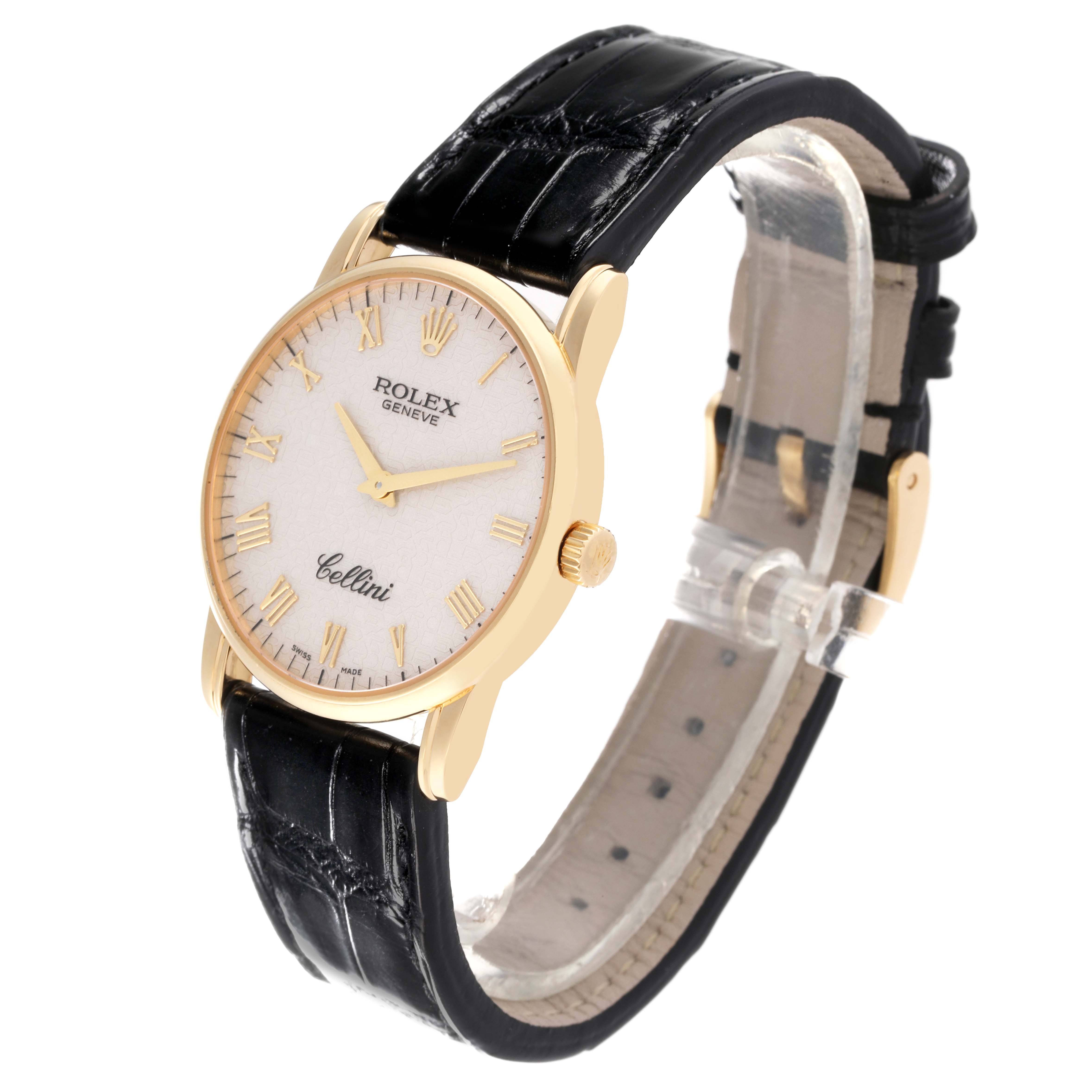 This image shows a Rolex Cellini 5116/8 Men's Yellow Gold Silver Dial 5116/8 Men's Yellow Gold Silver Dial watch at an oblique angle, highlighting its face, gold casing, crown, and black leather strap.