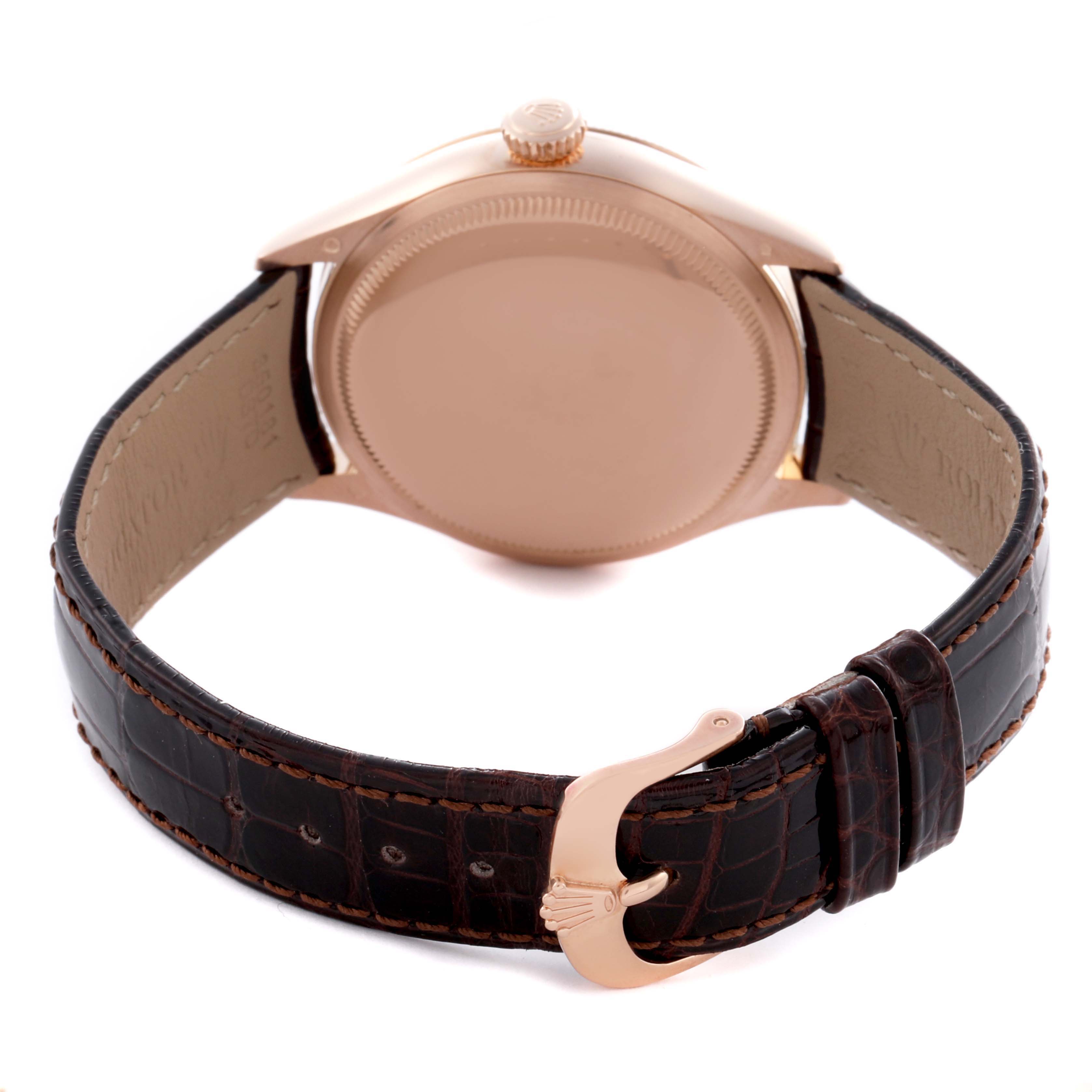 The image shows the back view of a Rolex Cellini 50505 Men's Rose Gold Black Dial watch, highlighting the case back, crown, and leather strap with a buckle.