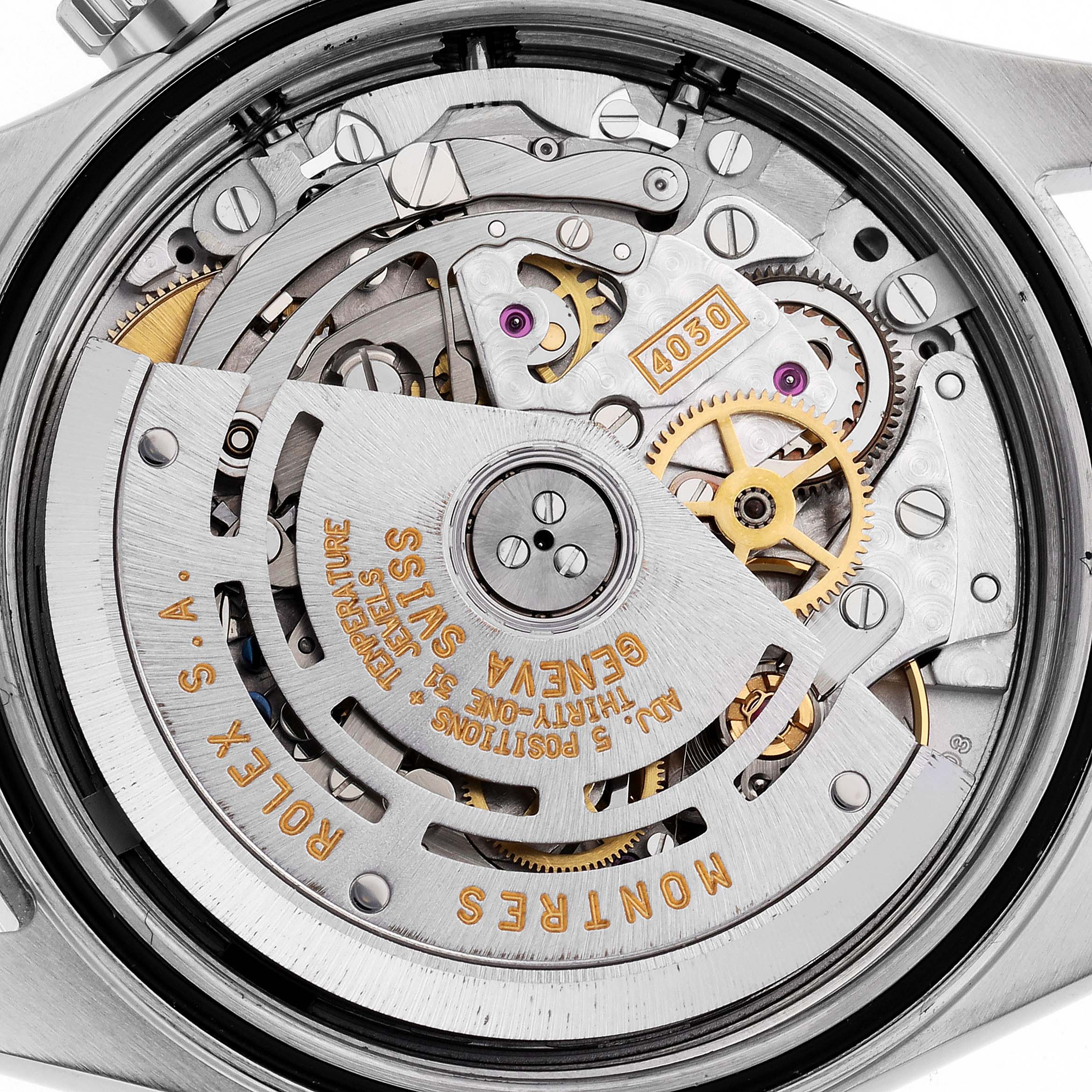 The image shows the back view of a Rolex Daytona 16520 Men
s Stainless Steel White Dial, highlighting its intricate mechanical movement.