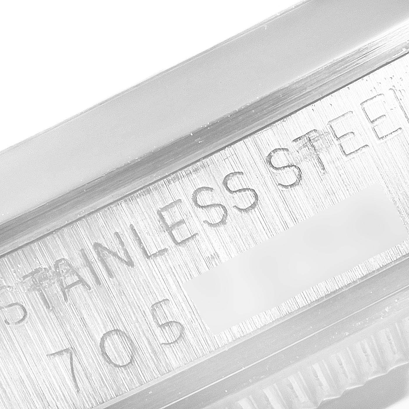 The image shows a close-up of the serial number engraving on the stainless steel case of the Rolex Vintage Collection 15000 Men's Stainless Steel Black Dial 15000 Men's Stainless Steel Black Dial watch.