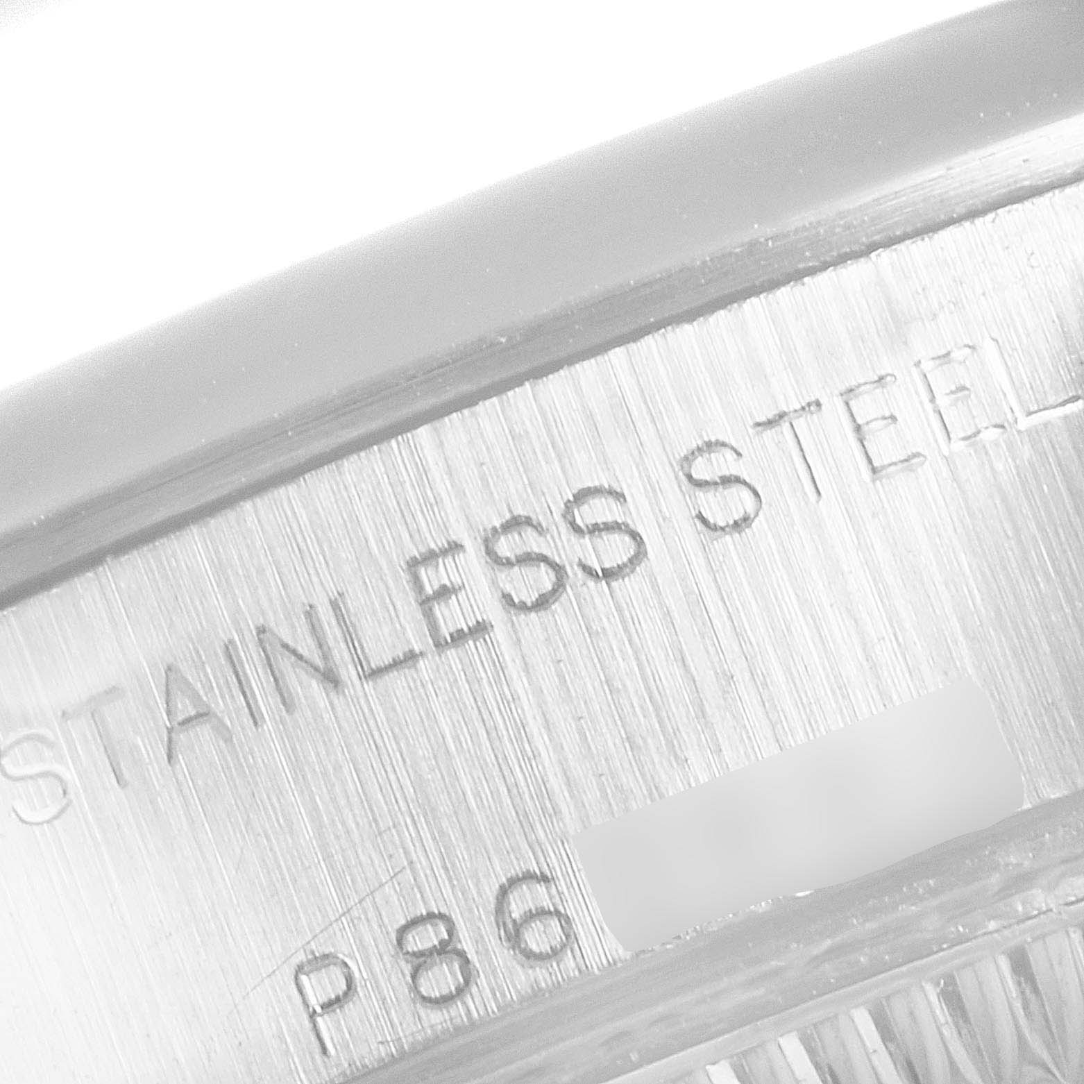 This image shows the engraved case side of a Rolex Datejust 79160 Women's Stainless Steel Silver Dial 79160 Women's Stainless Steel Silver Dial watch, highlighting the "STAINLESS STEEL" text.