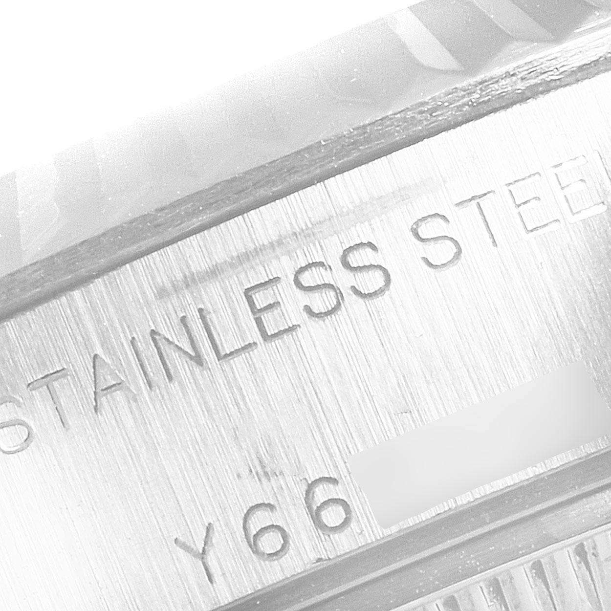 This image shows a close-up of the engravings on the stainless steel case of a Rolex Datejust 79174 Women's Stainless Steel Black Dial 79174 Women's Stainless Steel Black Dial watch.