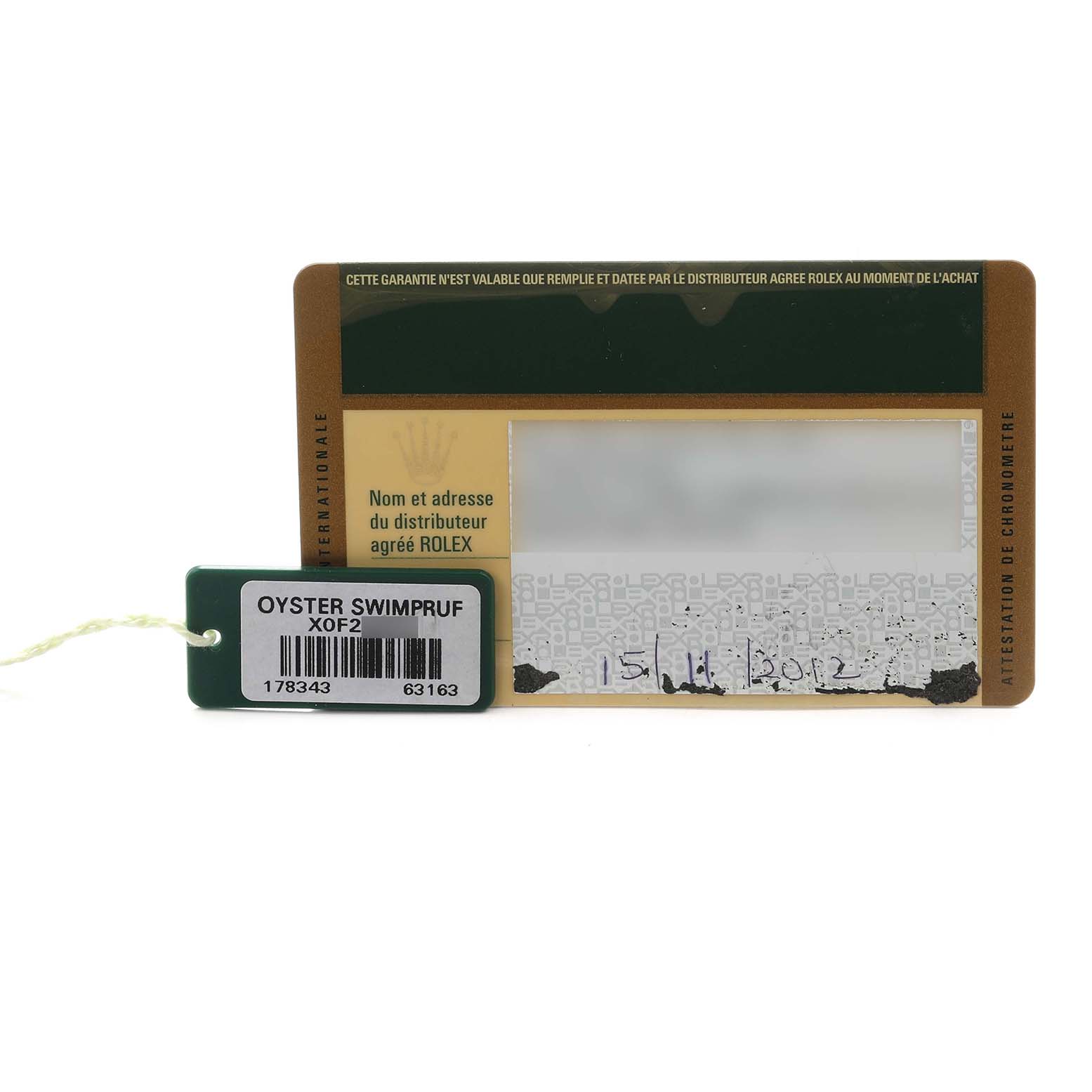 The image shows a Rolex Datejust 178343 Men's Steel and Gold (two tone) Silver Dial warranty card and an Oyster Swimpruf tag from a straight-on angle.