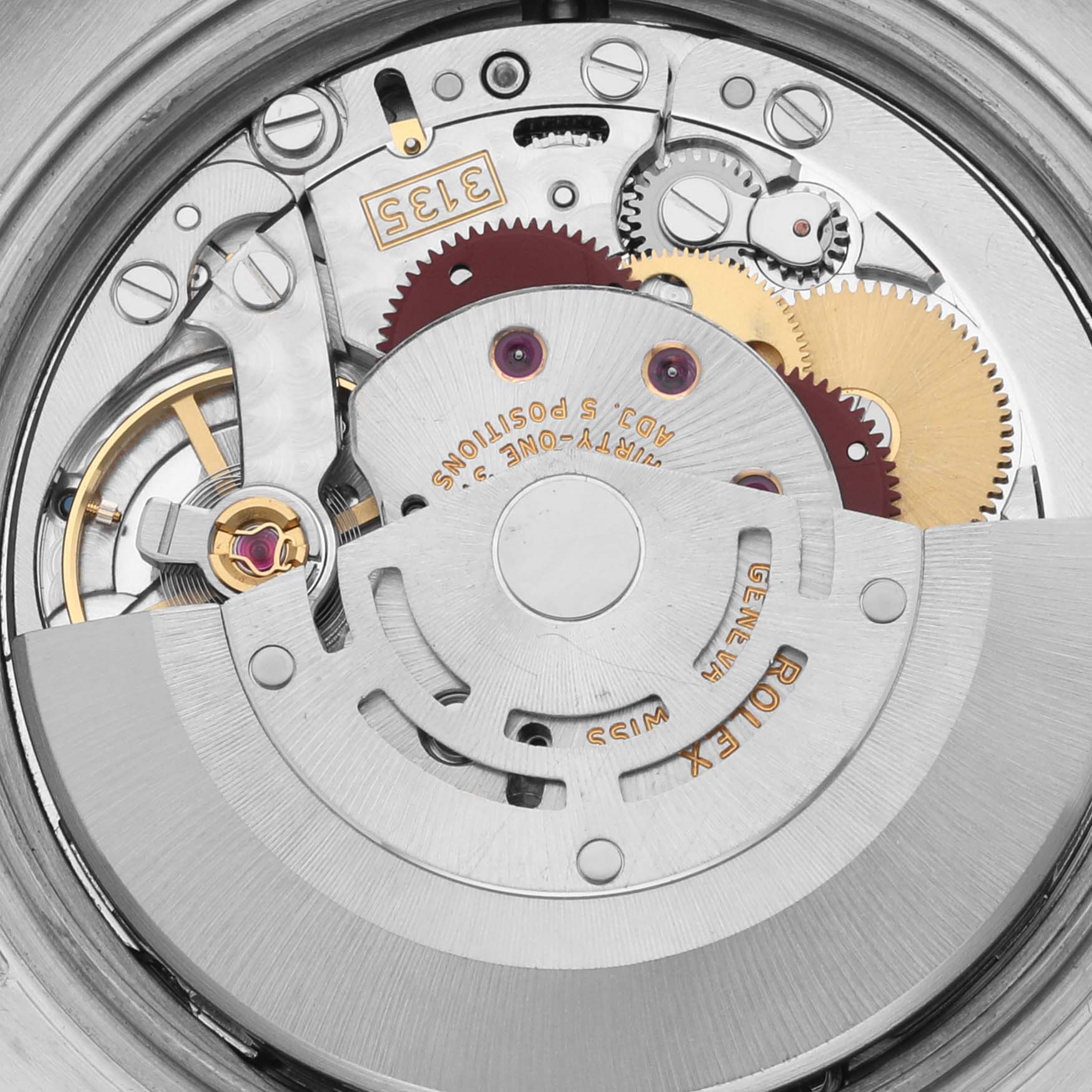 The image shows the intricate internal mechanics of a Rolex Datejust 116231 Men's Steel and Gold (two tone) Silver Dial 116231 Men's Steel and Gold (two tone) Silver Dial watch, highlighting gears and the rotor.