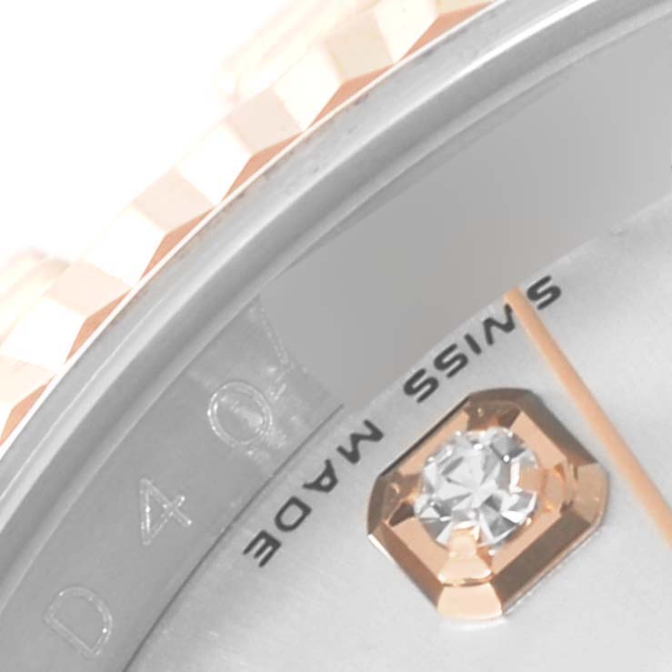 The image shows a close-up of the dial and part of the fluted bezel of a Rolex Datejust 116231 Men's Steel and Gold (two tone) Silver Dial 116231 Men's Steel and Gold (two tone) Silver Dial watch, highlighting the diamond marker and "Swiss Made" text.