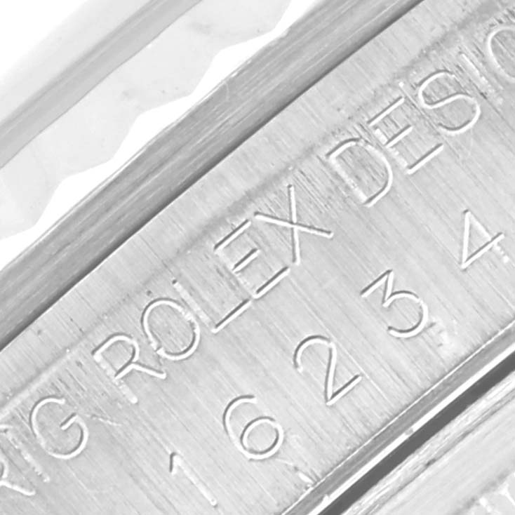 This image shows an angled, close-up view of the engraved case side on a Rolex Datejust 16234 Men's Stainless Steel Silver Dial 16234 Men's Stainless Steel Silver Dial watch.