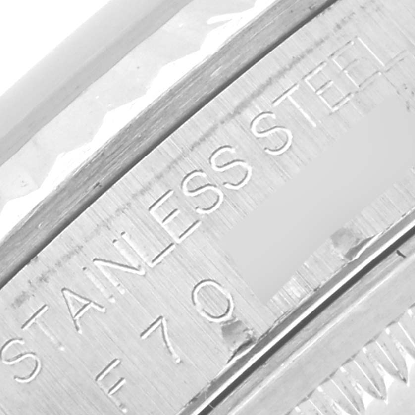 This image shows a close-up of the stainless steel caseback of a Rolex Datejust 16234 Men's Stainless Steel Silver Dial 16234 Men's Stainless Steel Silver Dial model watch.