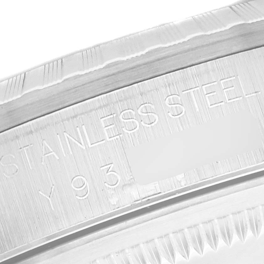 This image shows an engraved edge of the stainless steel case back of a Rolex Datejust 16220 Men's Stainless Steel White Dial 16220 Men's Stainless Steel White Dial watch.