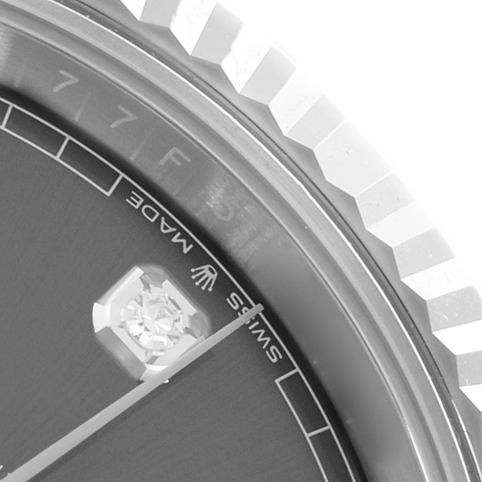 The image shows a close-up of the bezel, index, and part of the dial of a Rolex Datejust 41 126334 Men
s Stainless Steel Grey Dial watch.