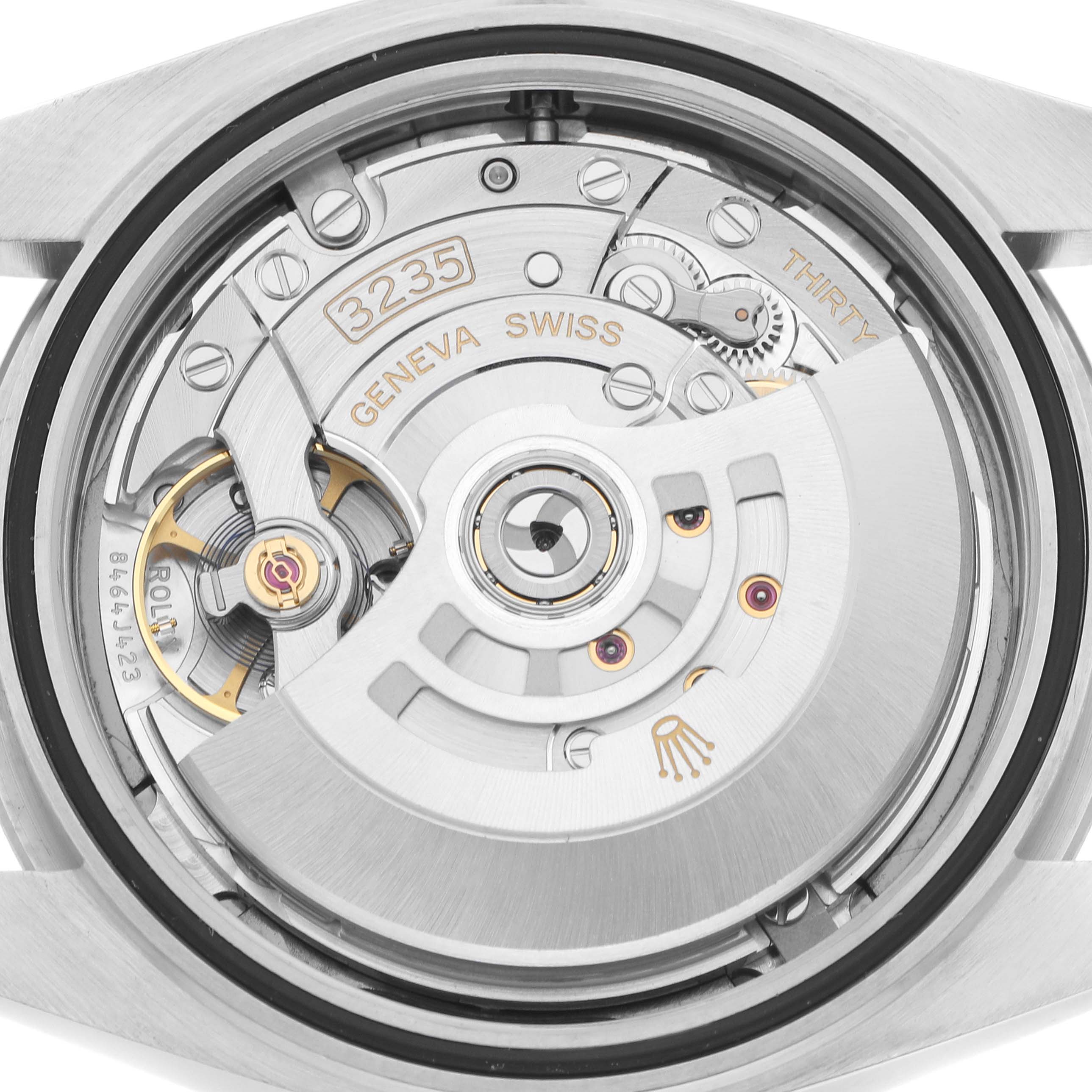 The image shows the movement of the Rolex Datejust 41 126334 Men
s Stainless Steel Grey Dial from a rear view, highlighting its intricate mechanical components and rotor.